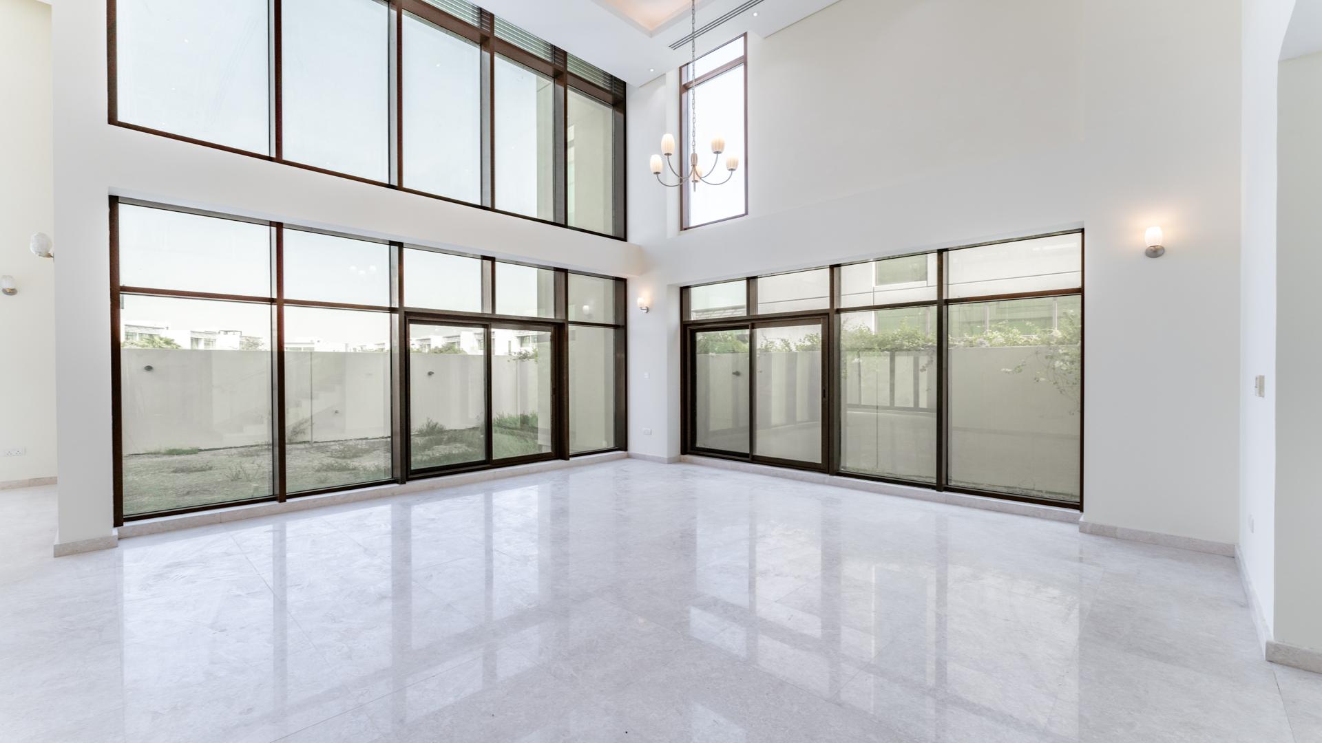 Modern kitchen in 6-bedroom villa, Meydan Gated Community, featuring sleek design and ample cabinetry