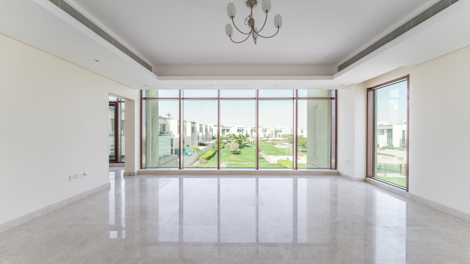 Modern villas with glass facades in Meydan Gated Community, viewed from balcony