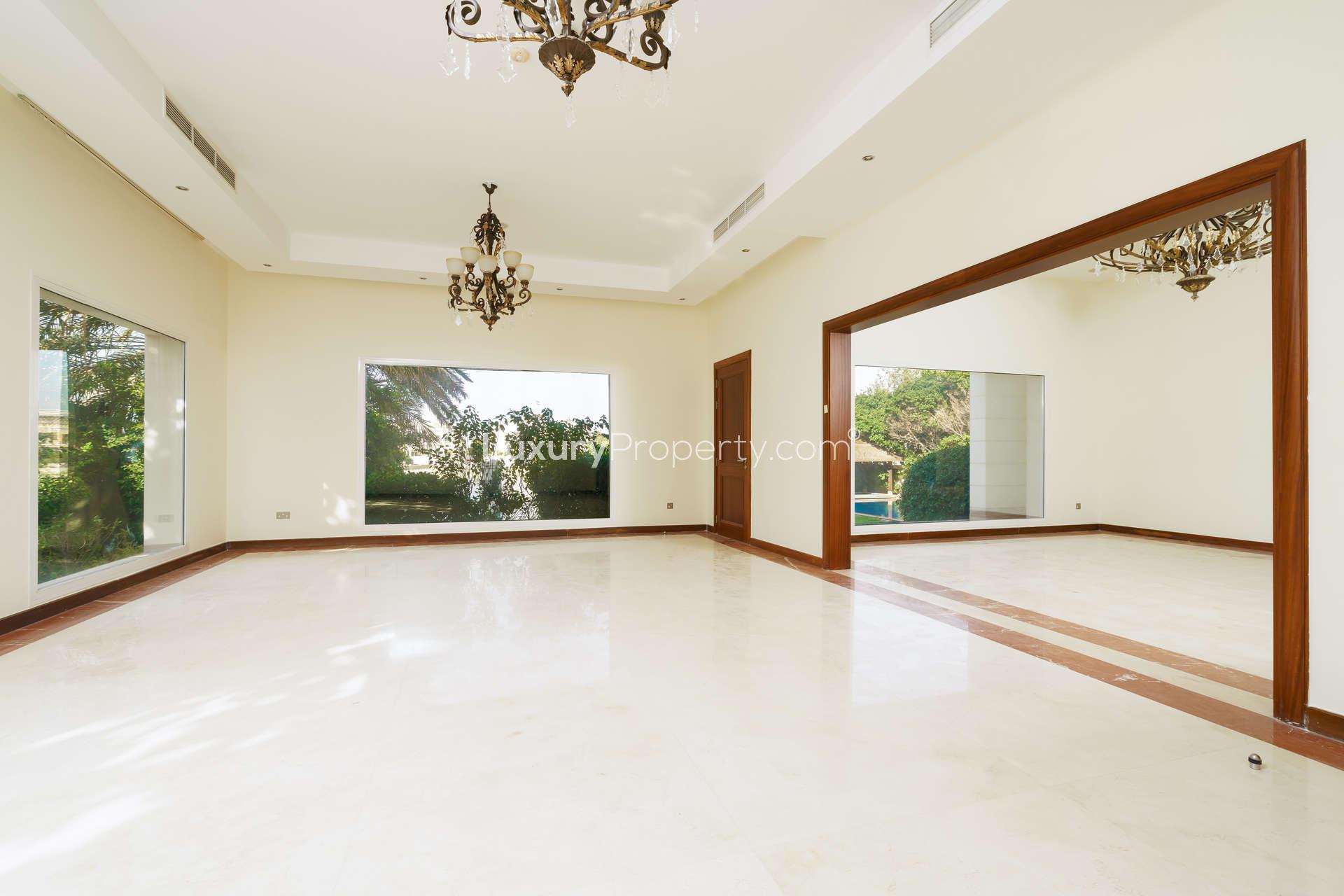 N/A,Spacious living area with large windows in Emirates Hills villa, Sector W
