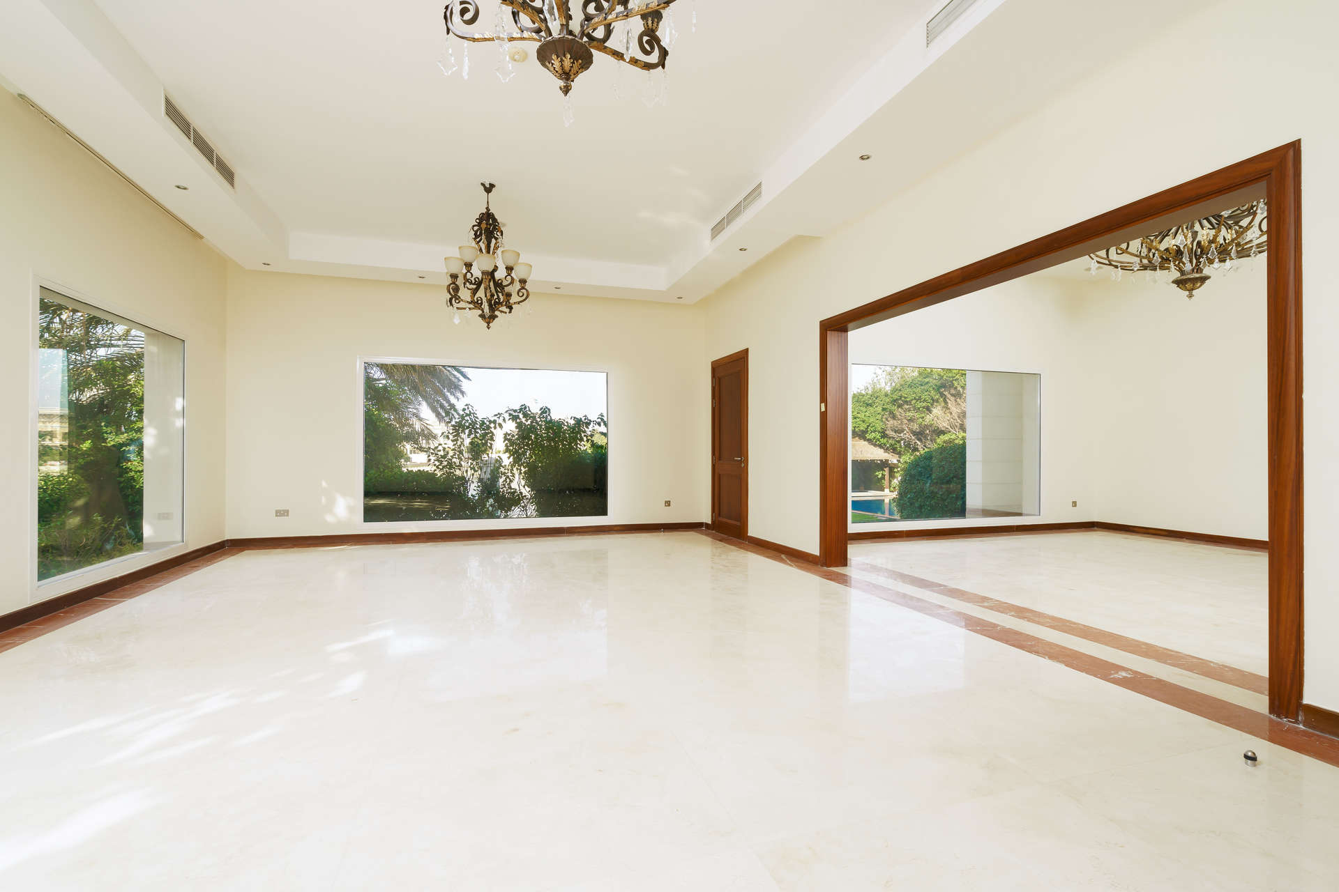 N/A,Spacious living area with large windows in Emirates Hills villa, Sector W