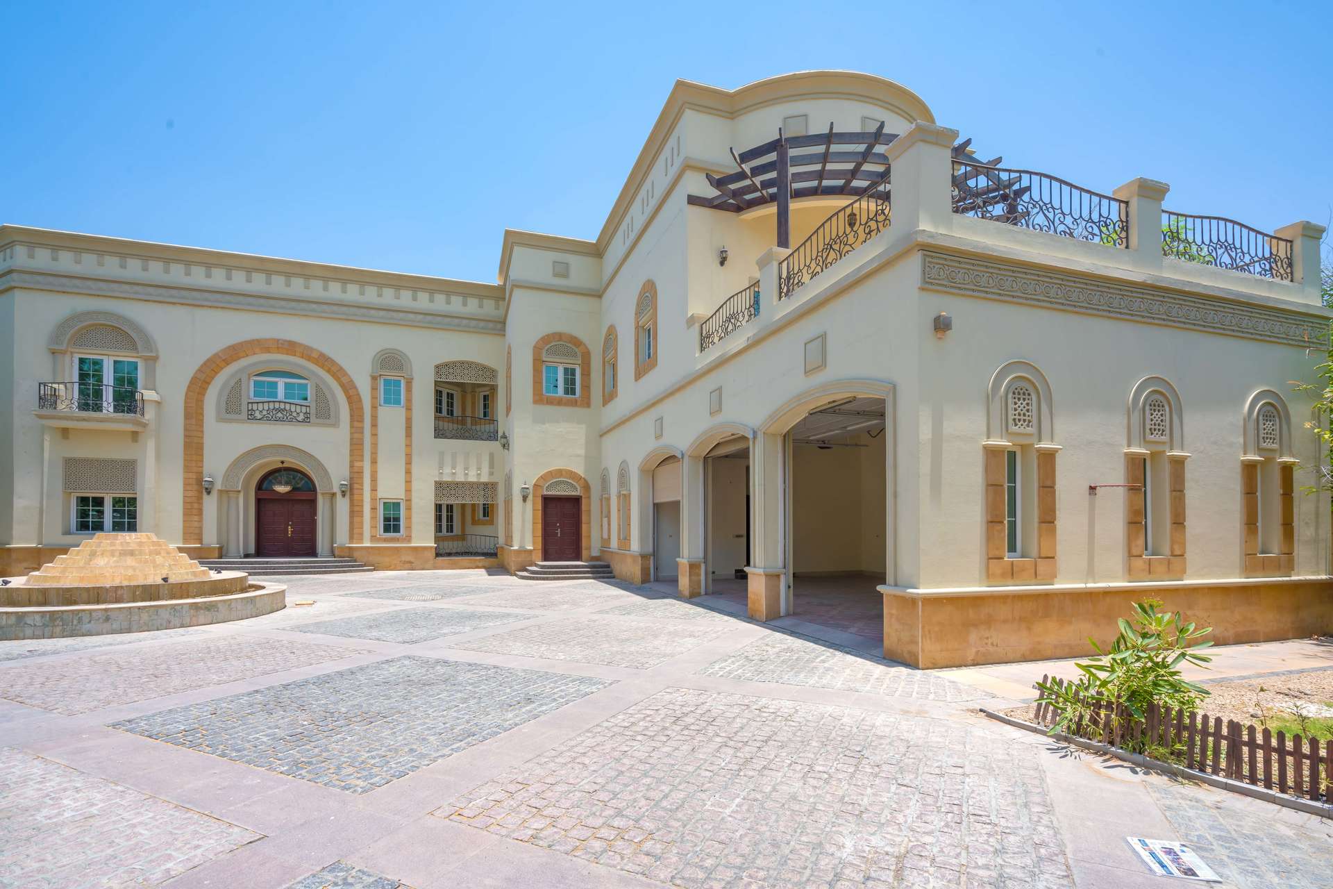 Stunning Emirates Hills villa exterior with fountain, available for rent, six bedrooms, Sector W