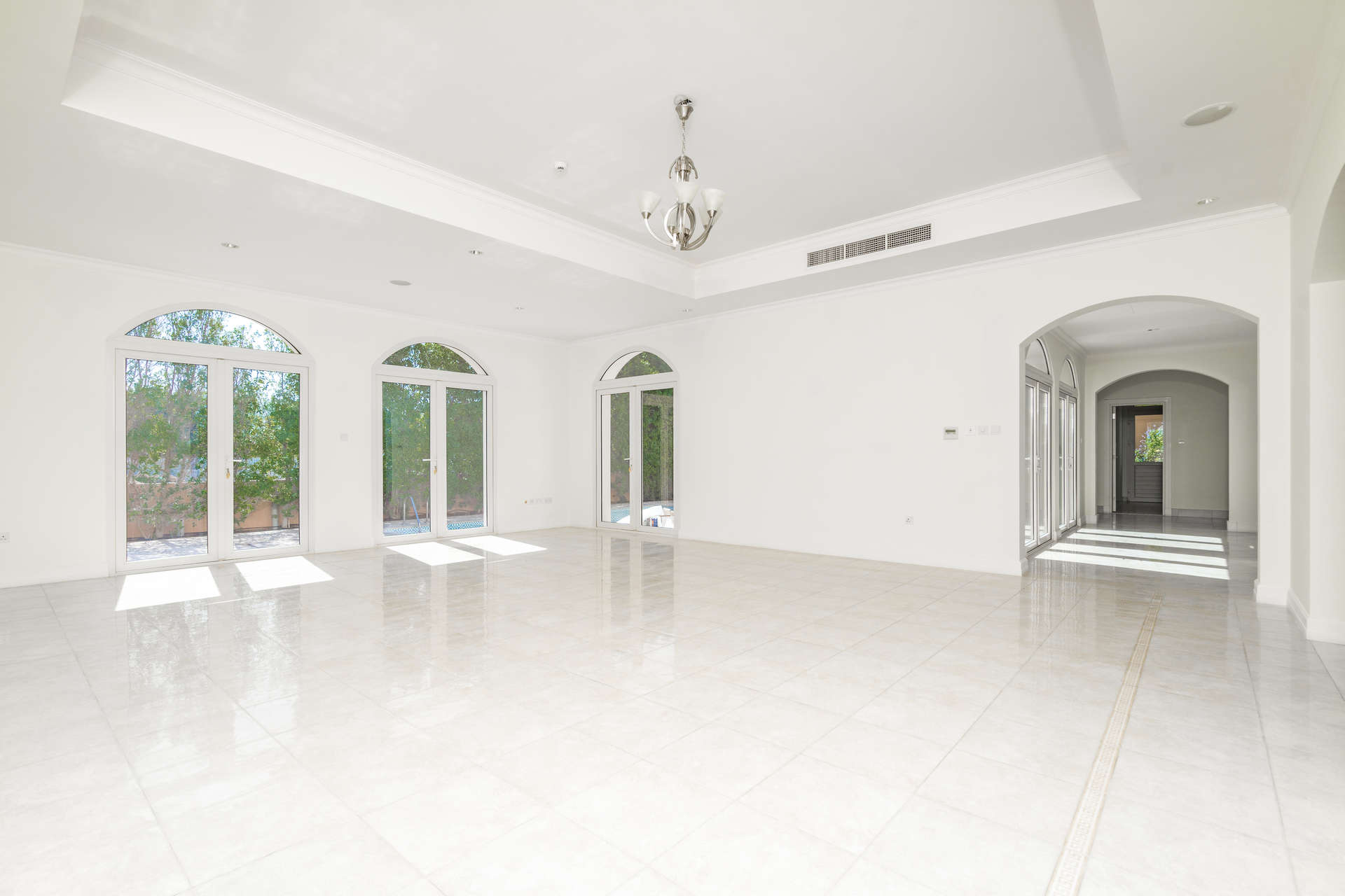 Spacious living area in Valencia style villa, Jumeirah Golf Estates, with elegant windows