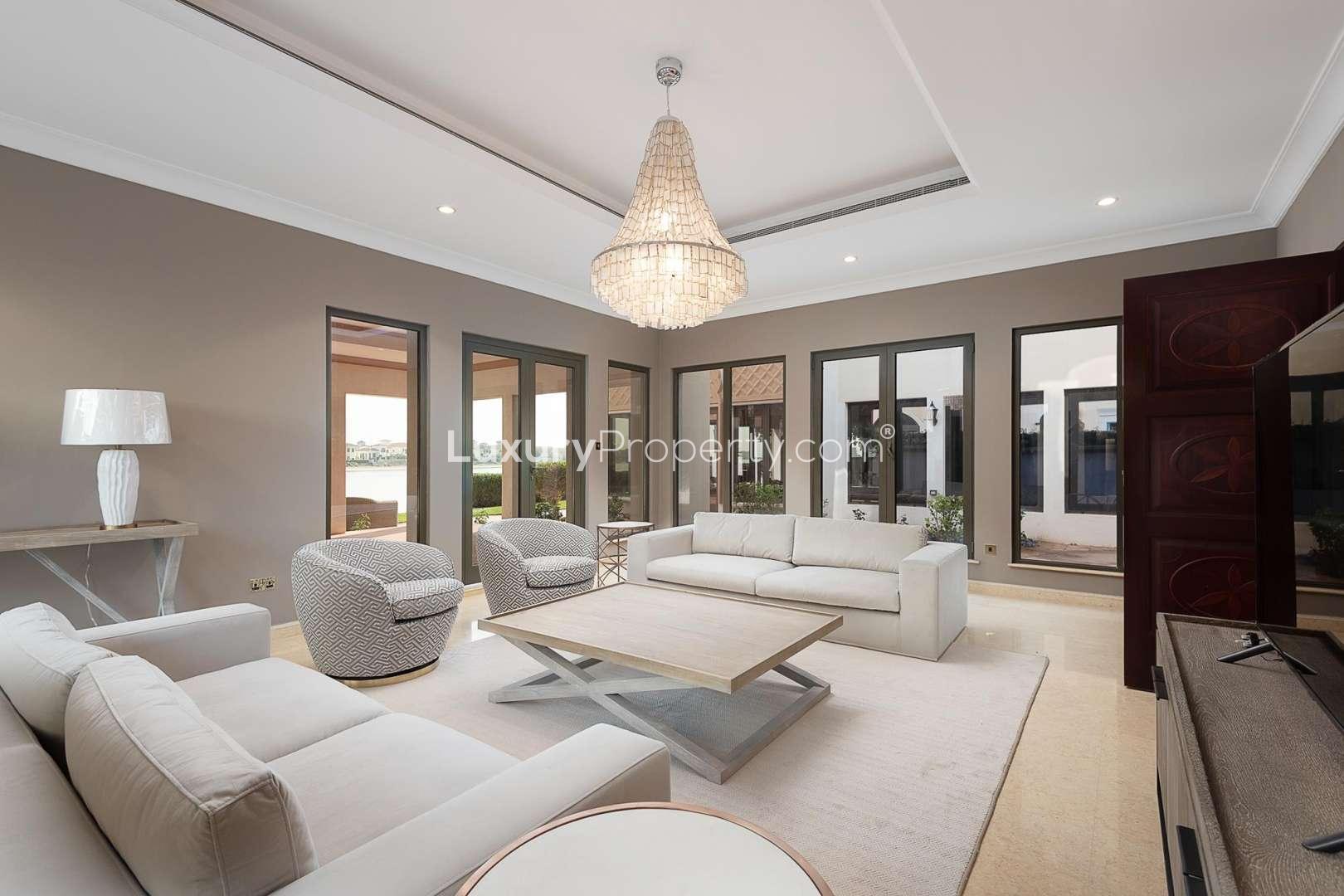 Luxurious dining room in Mediterranean-style villa, Palm Jumeirah, featuring elegant chandelier and decor