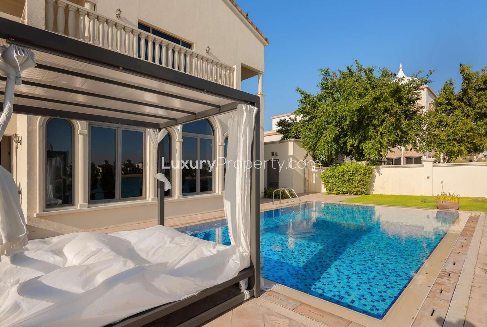 Spacious bedroom in luxury Palm Jumeirah villa, featuring modern decor and elegant lighting