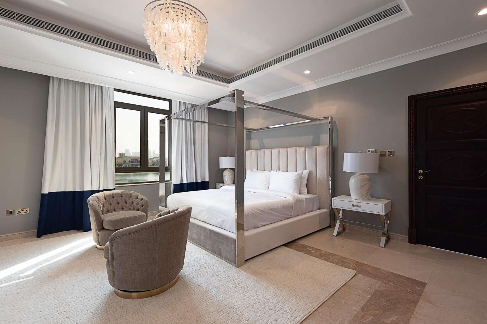 View from Signature Villa, Palm Jumeirah, overlooking serene beach and skyline. Short-term rental