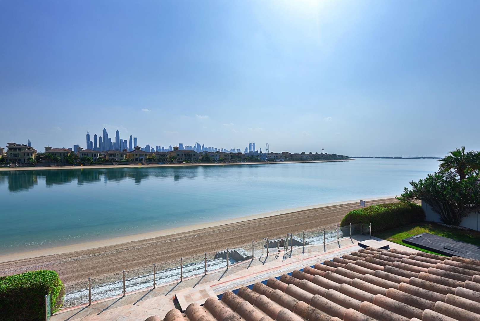Signature Villa exterior on Palm Jumeirah beach, available for short-term rental, 6 bedrooms