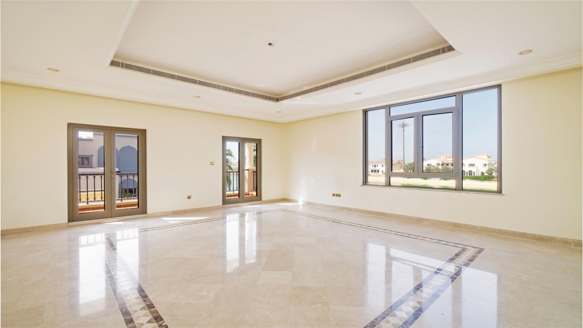 Spacious living area with large windows in Palm Jumeirah villa, Frond F, for sale
