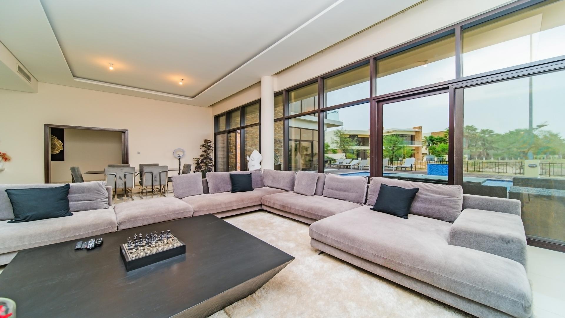 Modern 6-bedroom villa exterior with landscaped garden in Damac Hills, Silver Springs