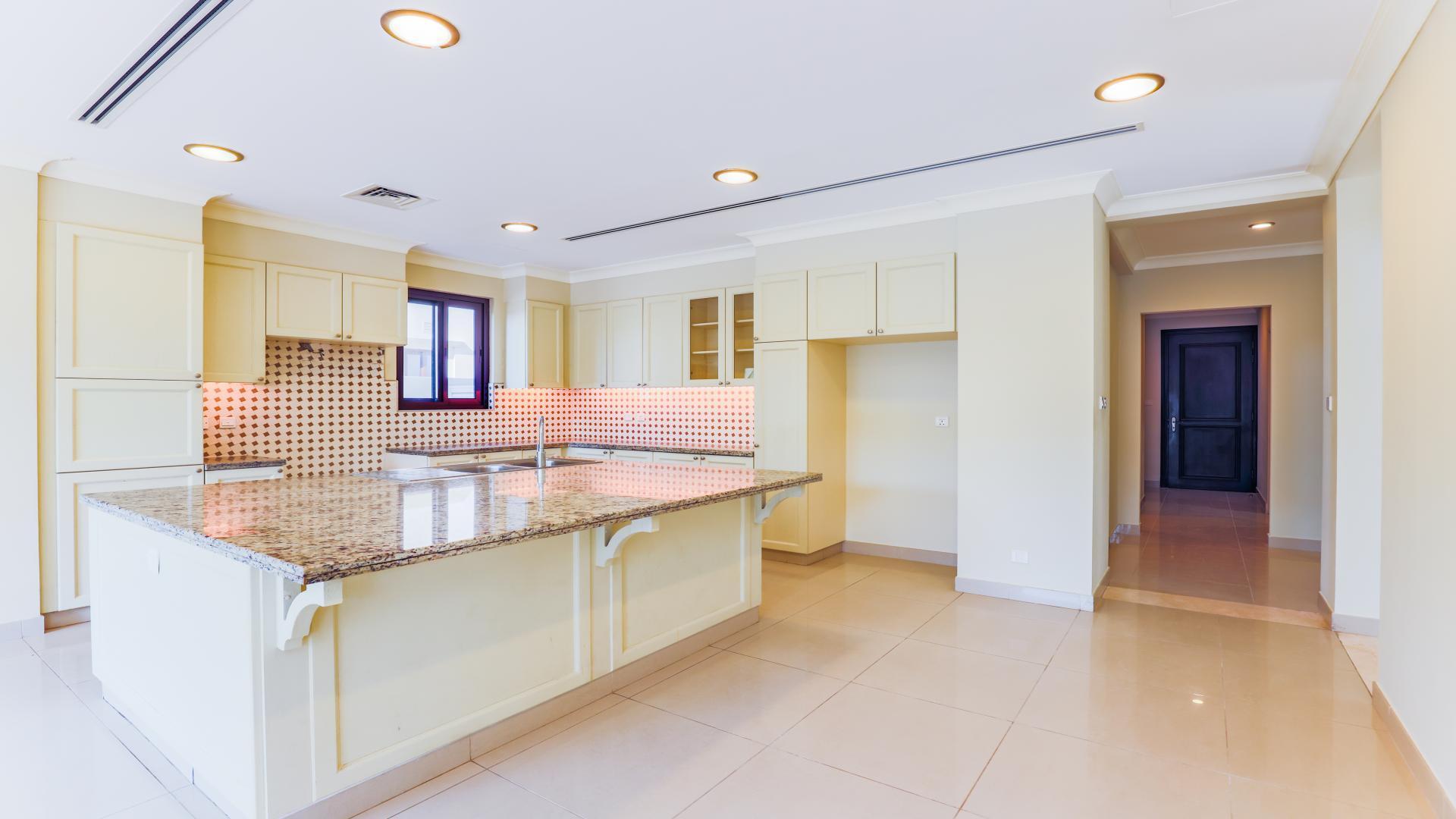 Spacious kitchen in 6-bedroom villa, Rosa, Arabian Ranches 2, with modern fixtures and island