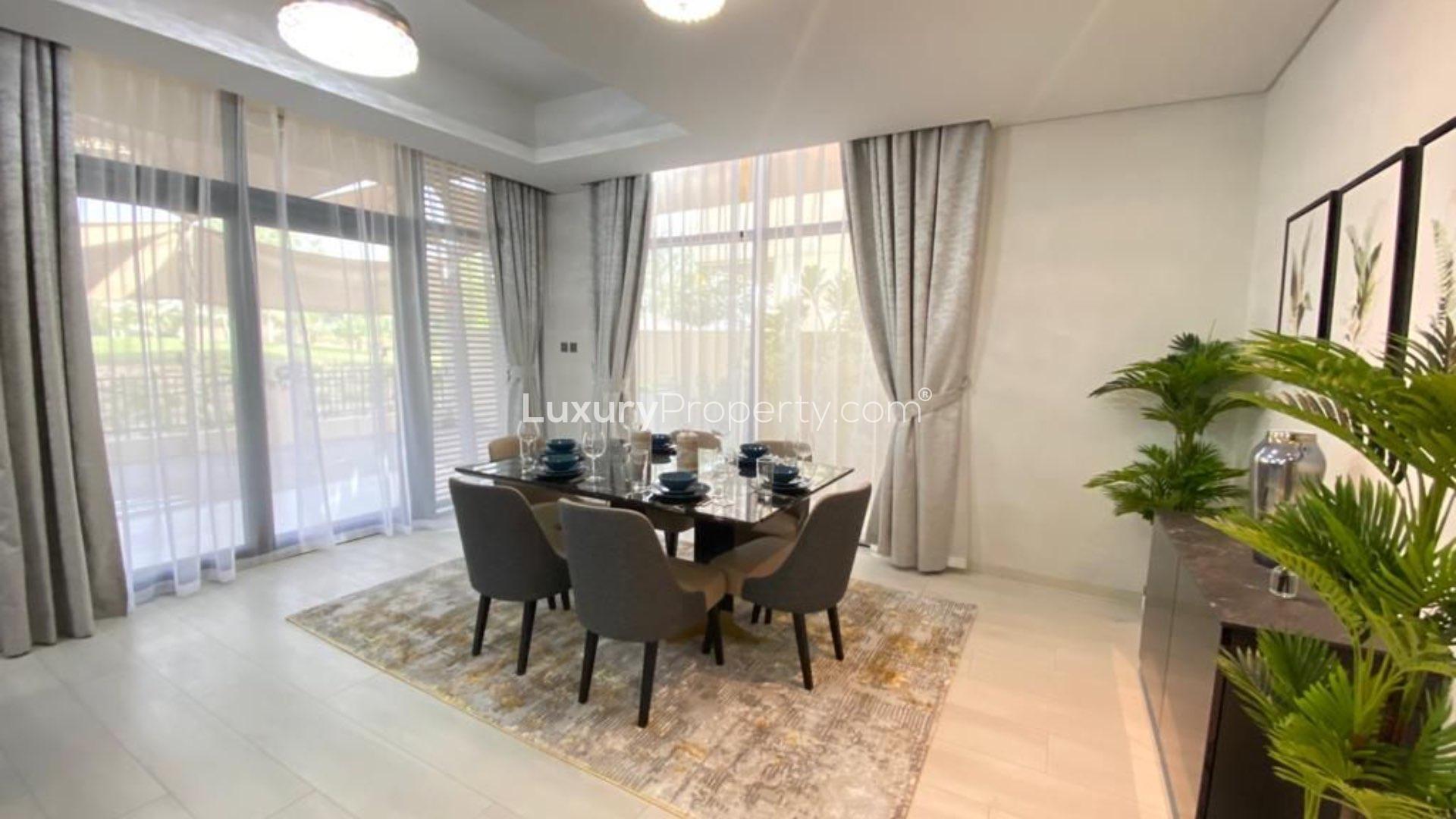 Fully furnished villa living room with modern decor in Damac Hills, The Field
