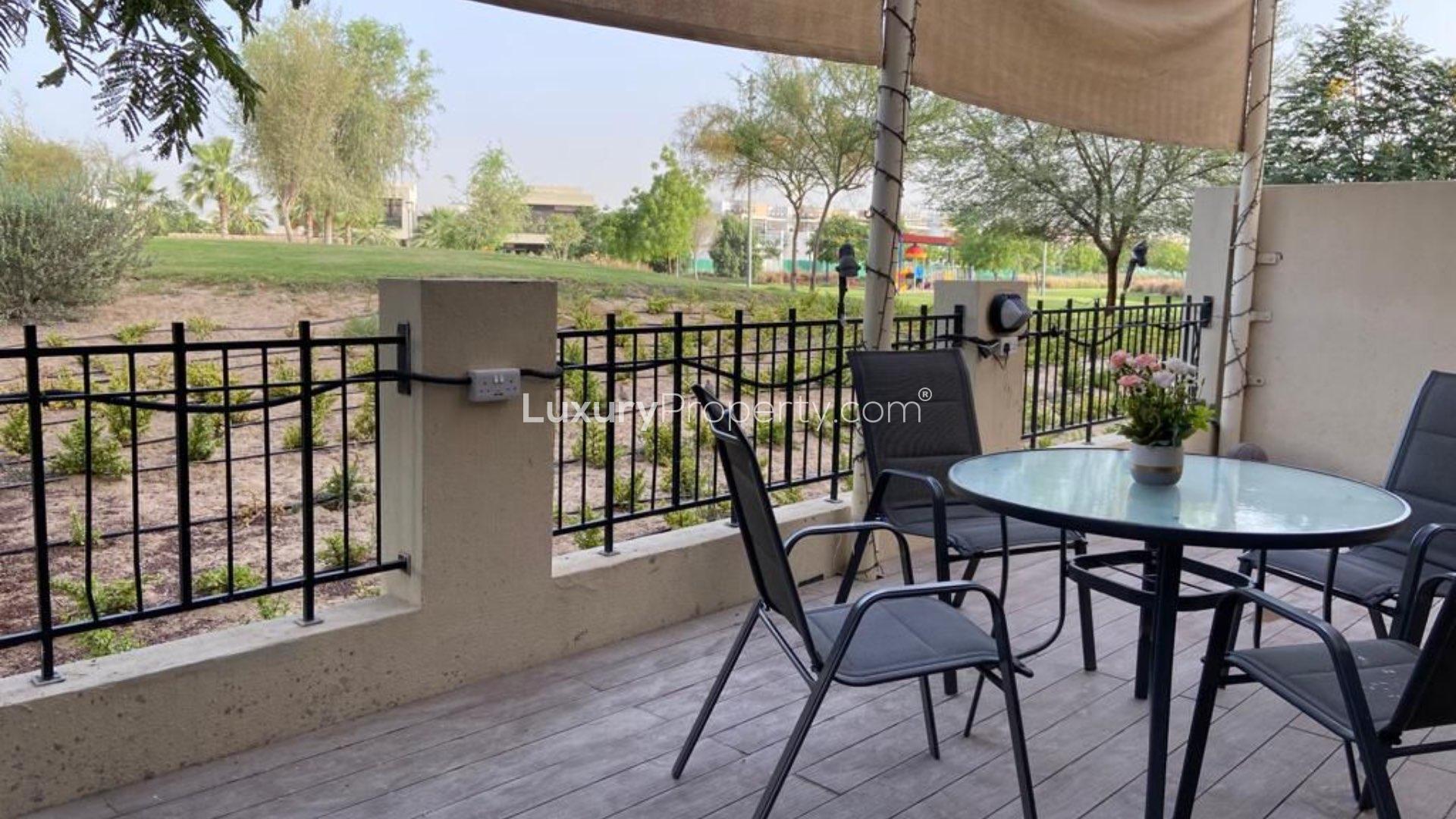 Fully furnished dining area in Damac Hills villa for rent, elegant decor and natural light