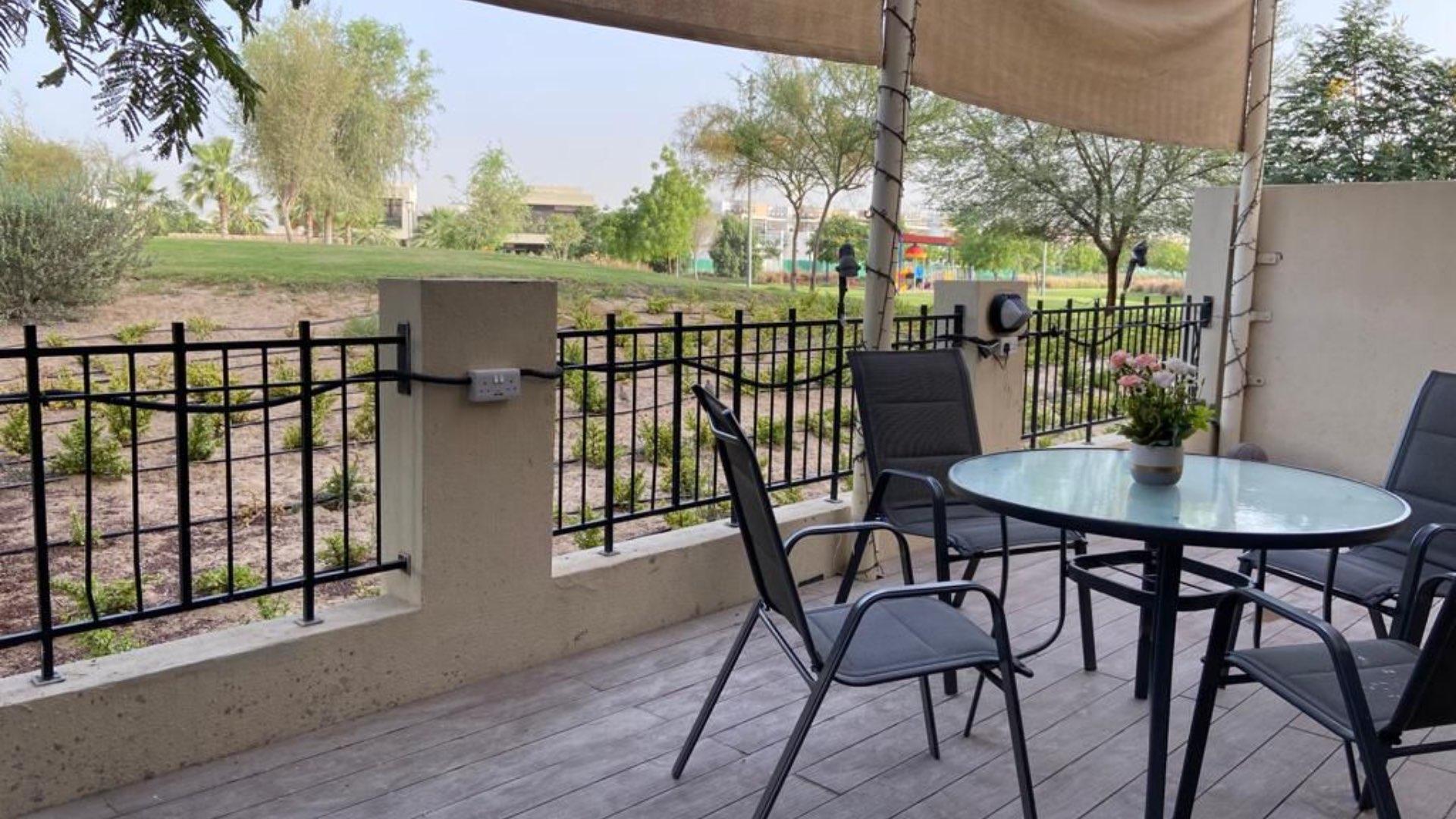 Fully furnished dining area in Damac Hills villa for rent, elegant decor and natural light