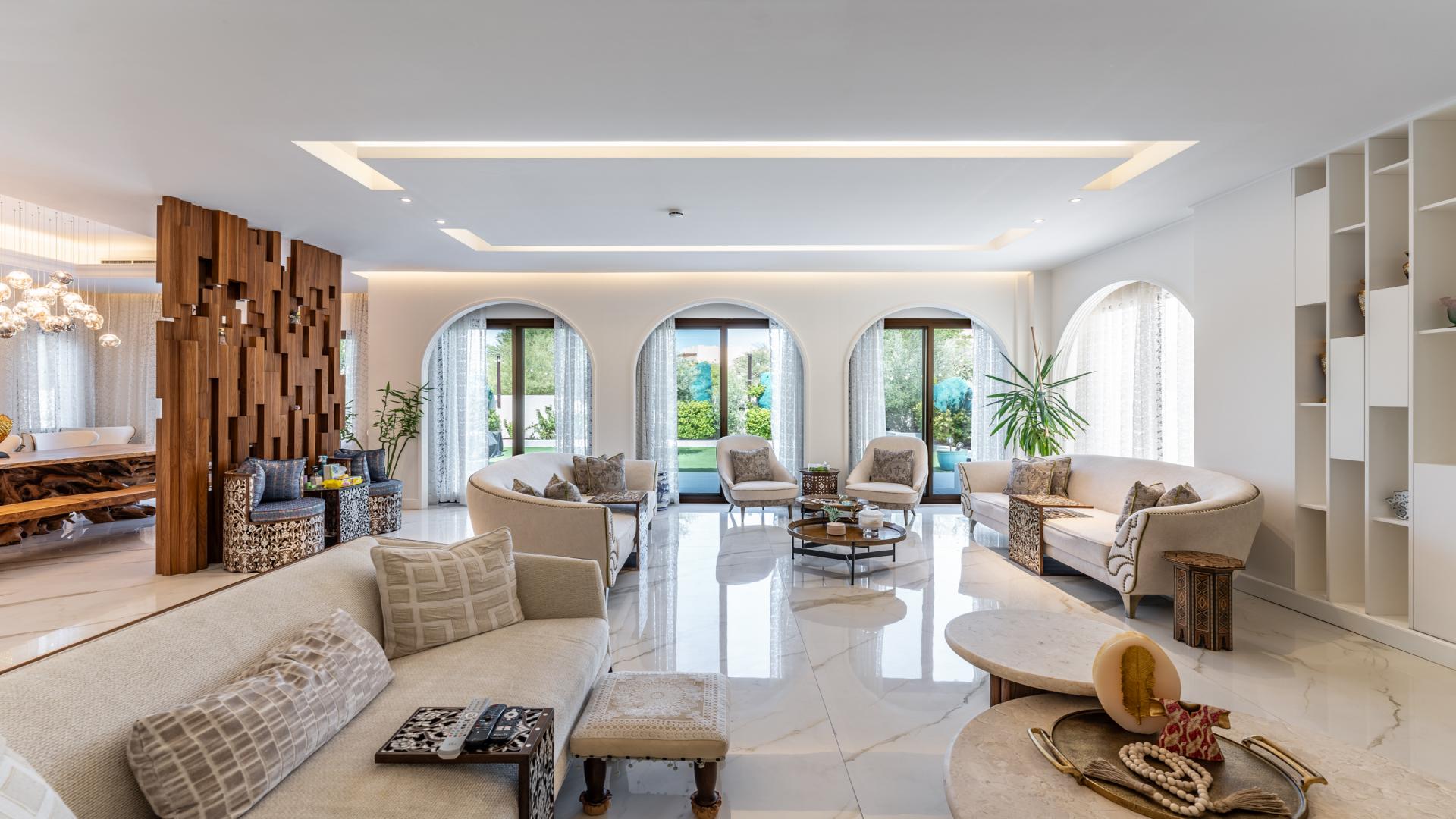 Luxury 4-bedroom villa exterior in Aseel, Arabian Ranches, with landscaped garden and driveway