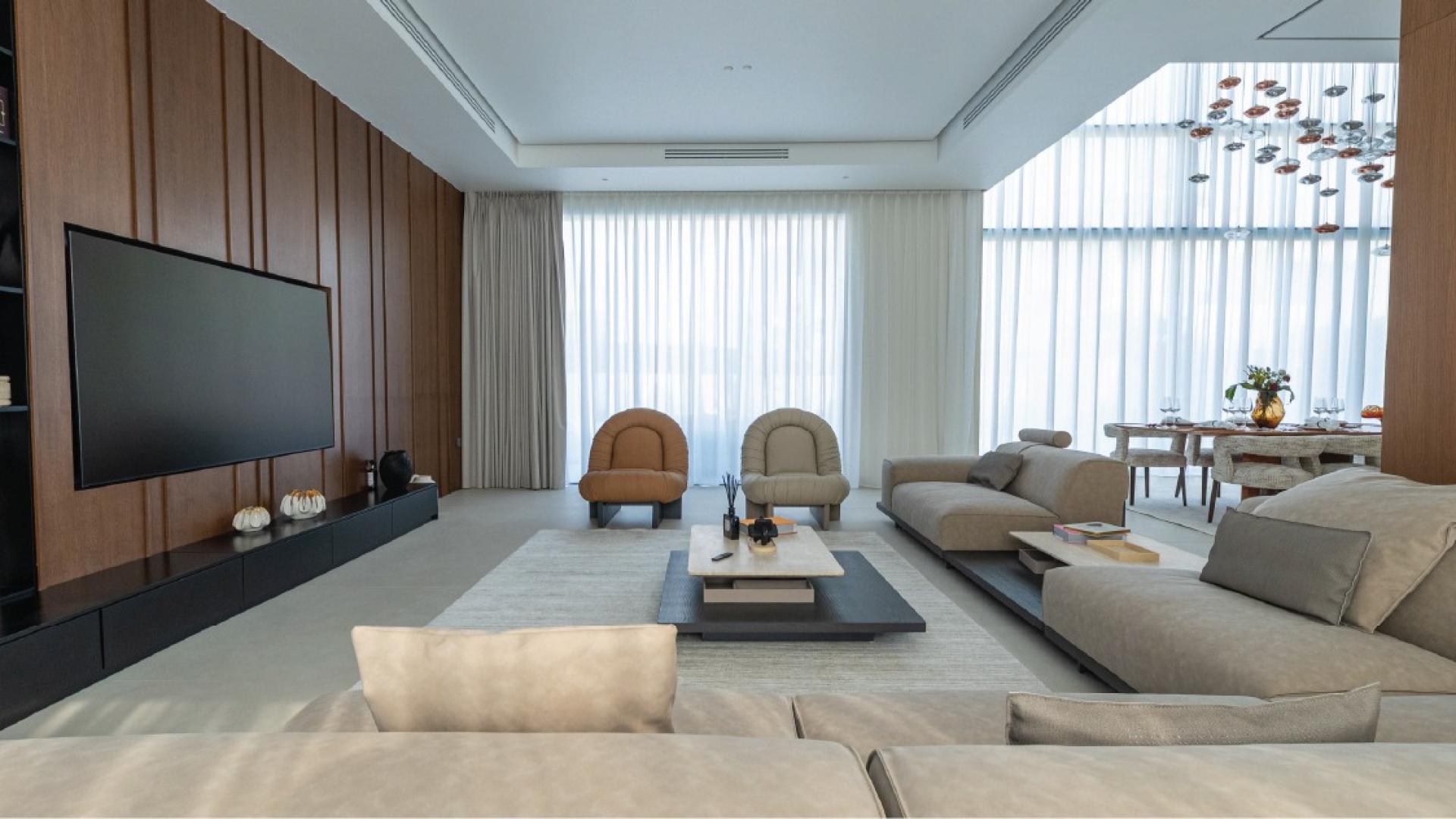 Luxurious dining room in Pearl Jumeirah villa for sale, featuring elegant decor and lighting