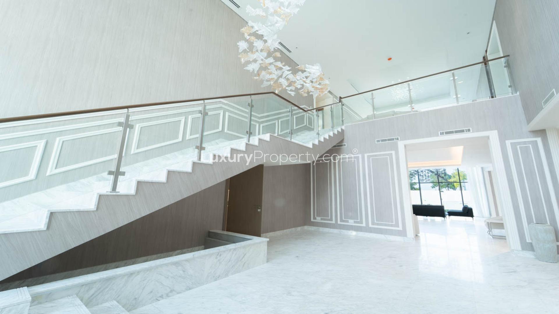 Luxury villa view with pool and city skyline in District One Phase III