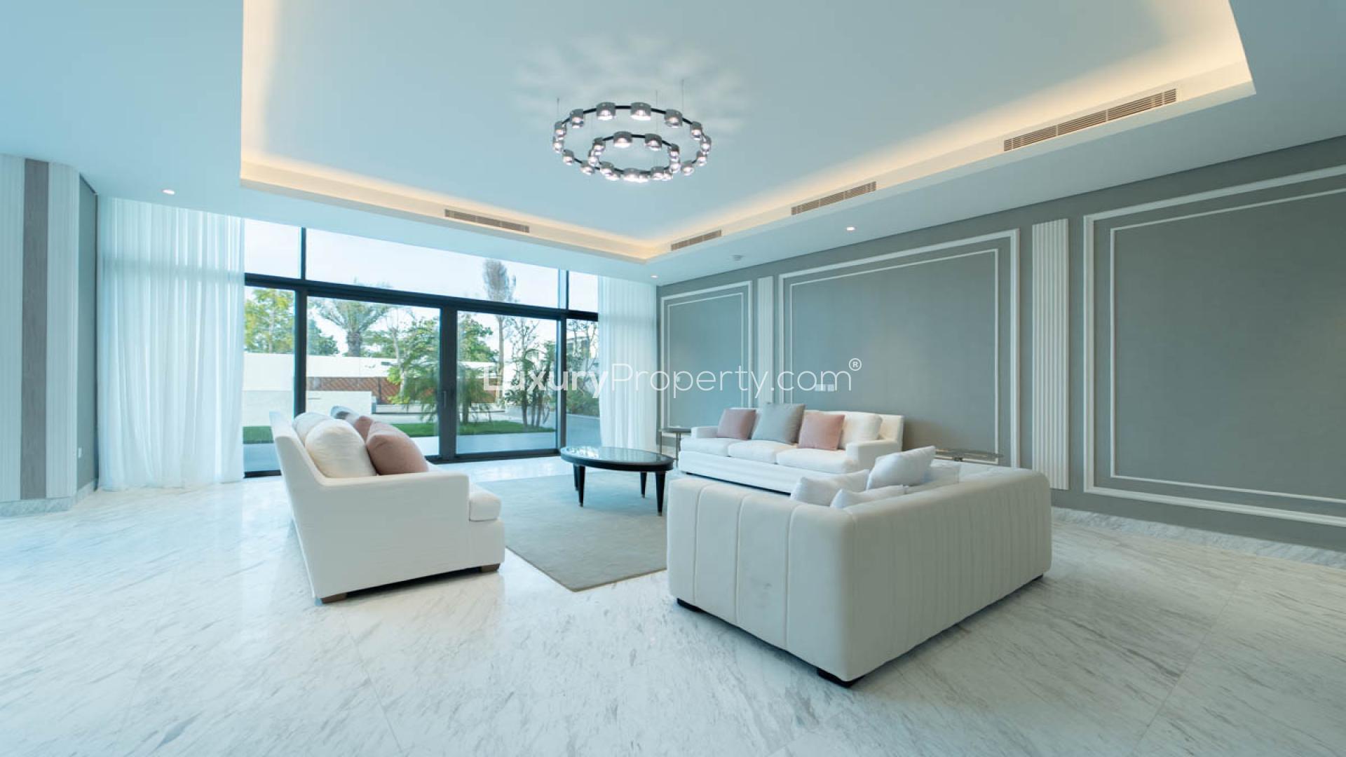 Luxurious villa interior with elegant chandelier in District One Phase III, spacious living area