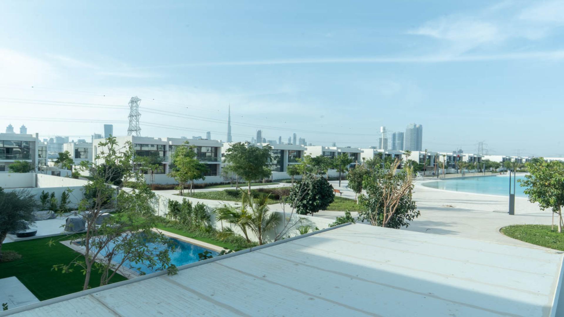 Luxurious villa interior with elegant chandelier in District One Phase III, spacious living area