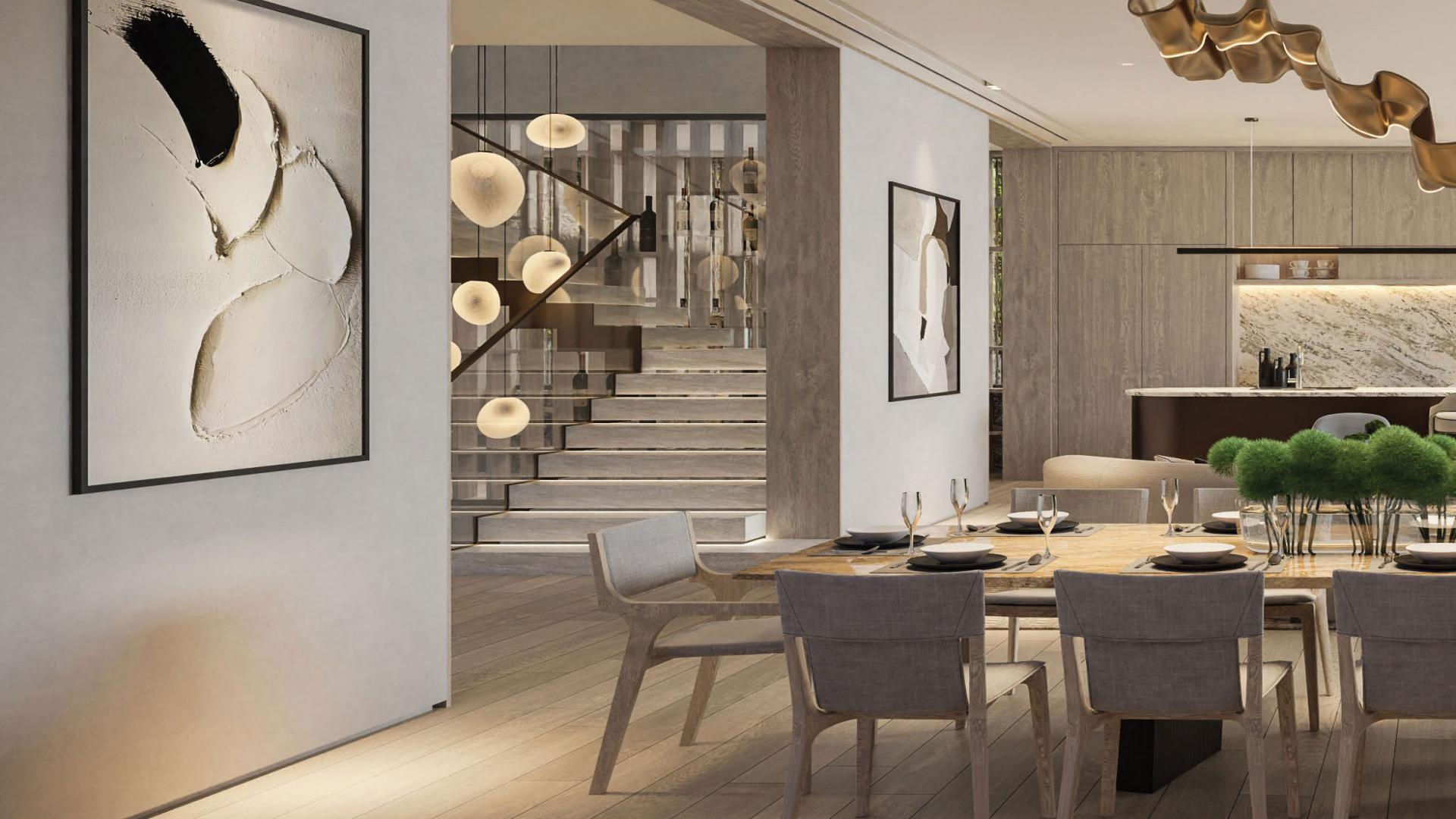 Luxurious outdoor seating area with fire pit at Tilal Al Ghaf villa for sale