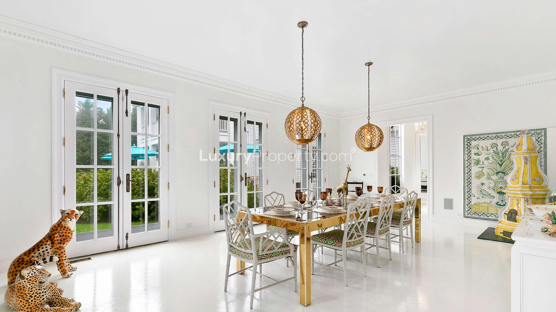 Elegant living room in six-bedroom villa, Hamptons, featuring fireplace and stylish decor