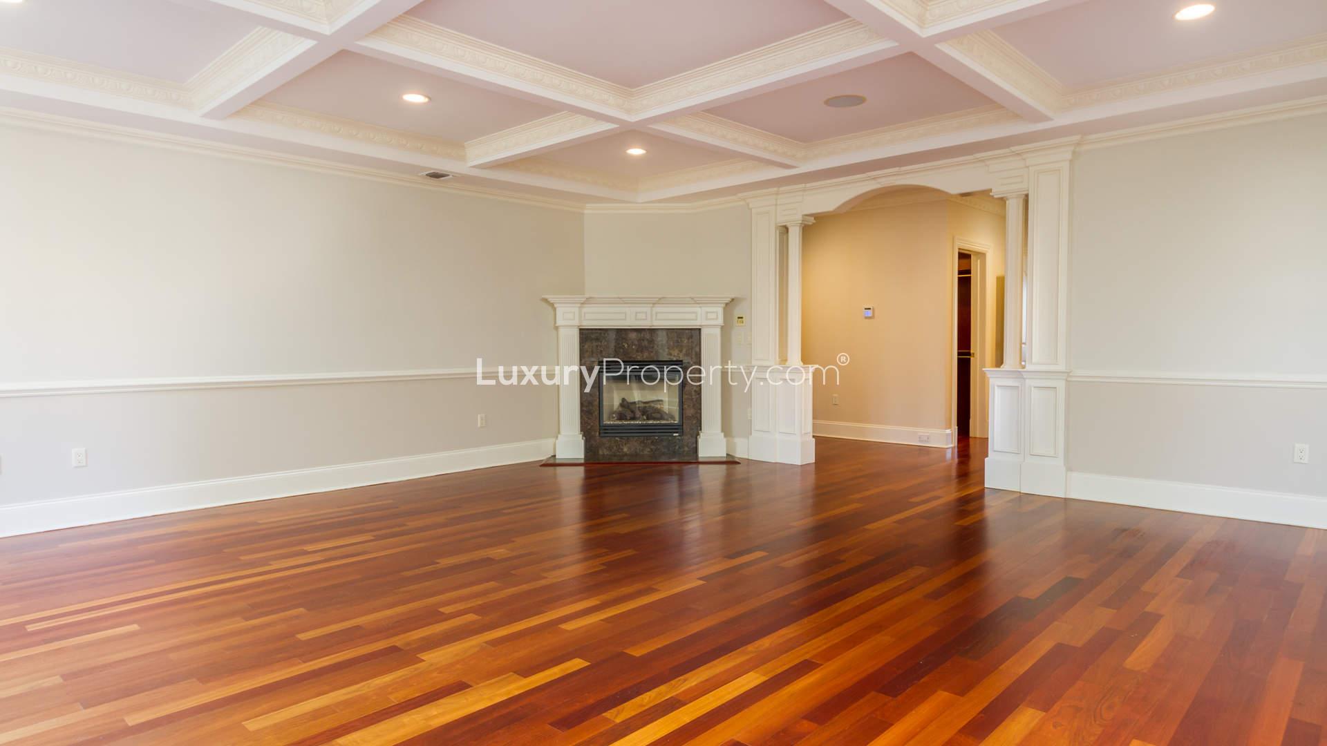 Luxurious wood-paneled room with fireplace in Saddle River villa, New Jersey