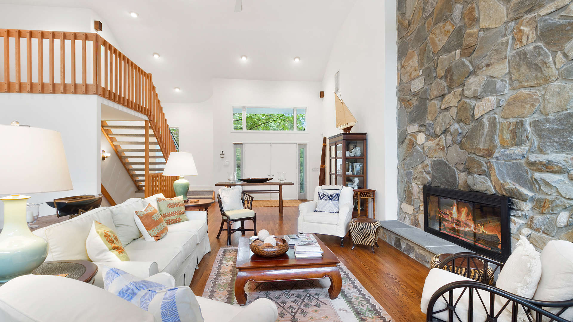 Spacious outdoor deck with seating at 6-bedroom villa, 53 Hidden Cove Court, Southampton