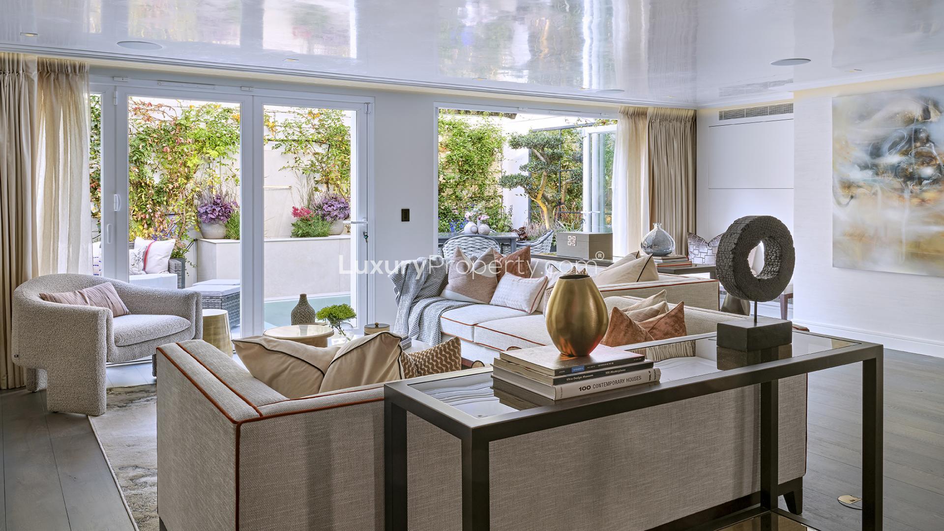Elegant living room in six-bedroom Knightsbridge villa with modern decor and luxurious furnishings