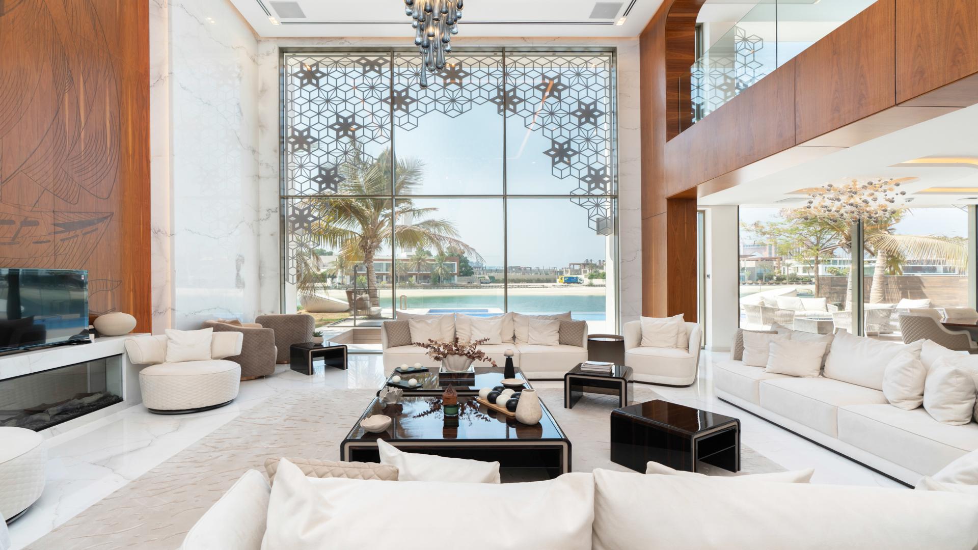 Luxurious living room in Palm Jumeirah villa with modern decor and sea views