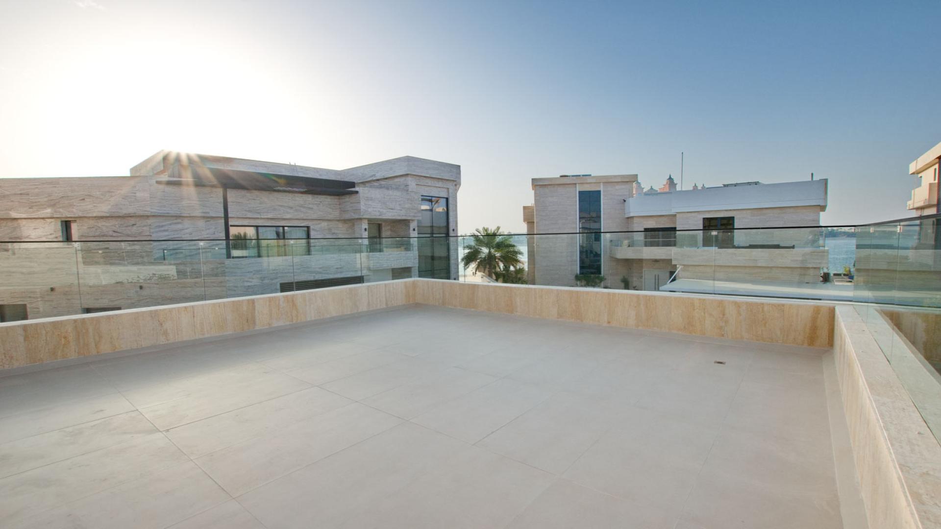 Beachfront view from luxury 6-bedroom villa with pool in Palm Jumeirah's Signature Villas