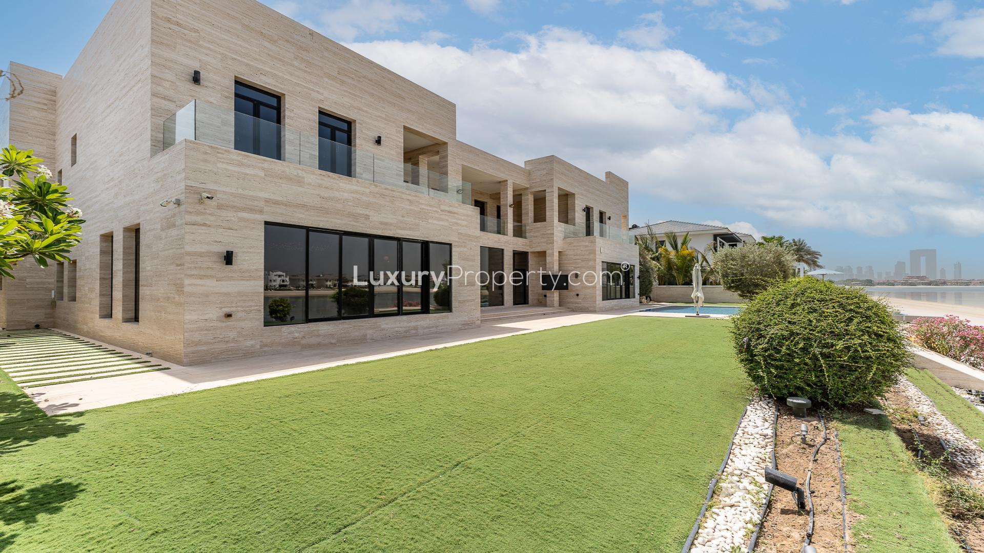 Luxurious living room in upgraded 6-bedroom villa, Palm Jumeirah, with modern decor and views