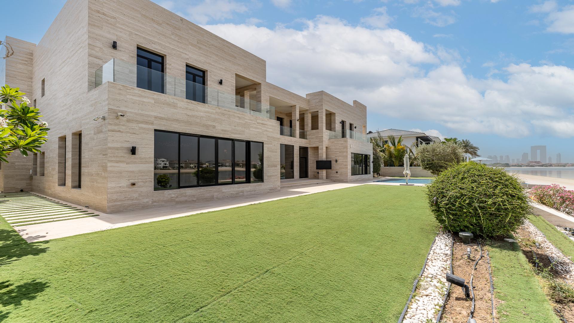 Luxurious living room in upgraded 6-bedroom villa, Palm Jumeirah, with modern decor and views