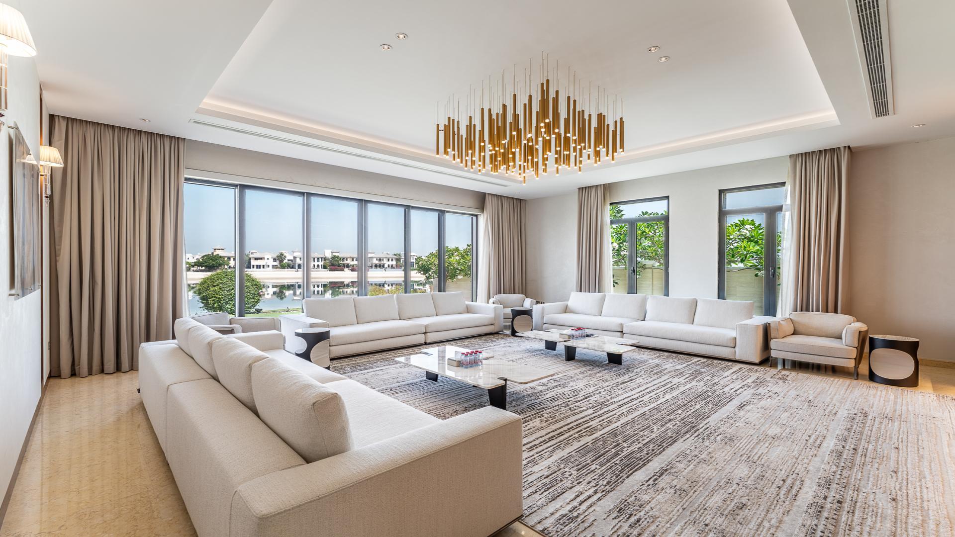 Exterior of 6-bedroom Signature Villa for sale, Palm Jumeirah, with garden and sunset view