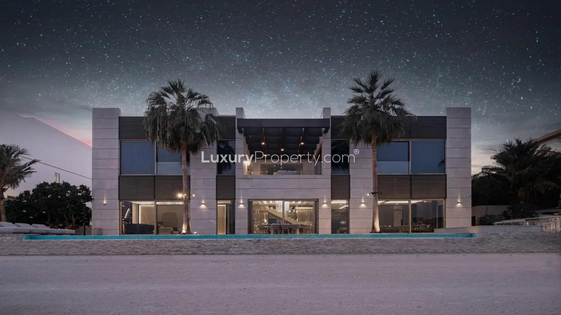 Beachfront view from luxury villa in Palm Jumeirah, showcasing skyline and serene waters