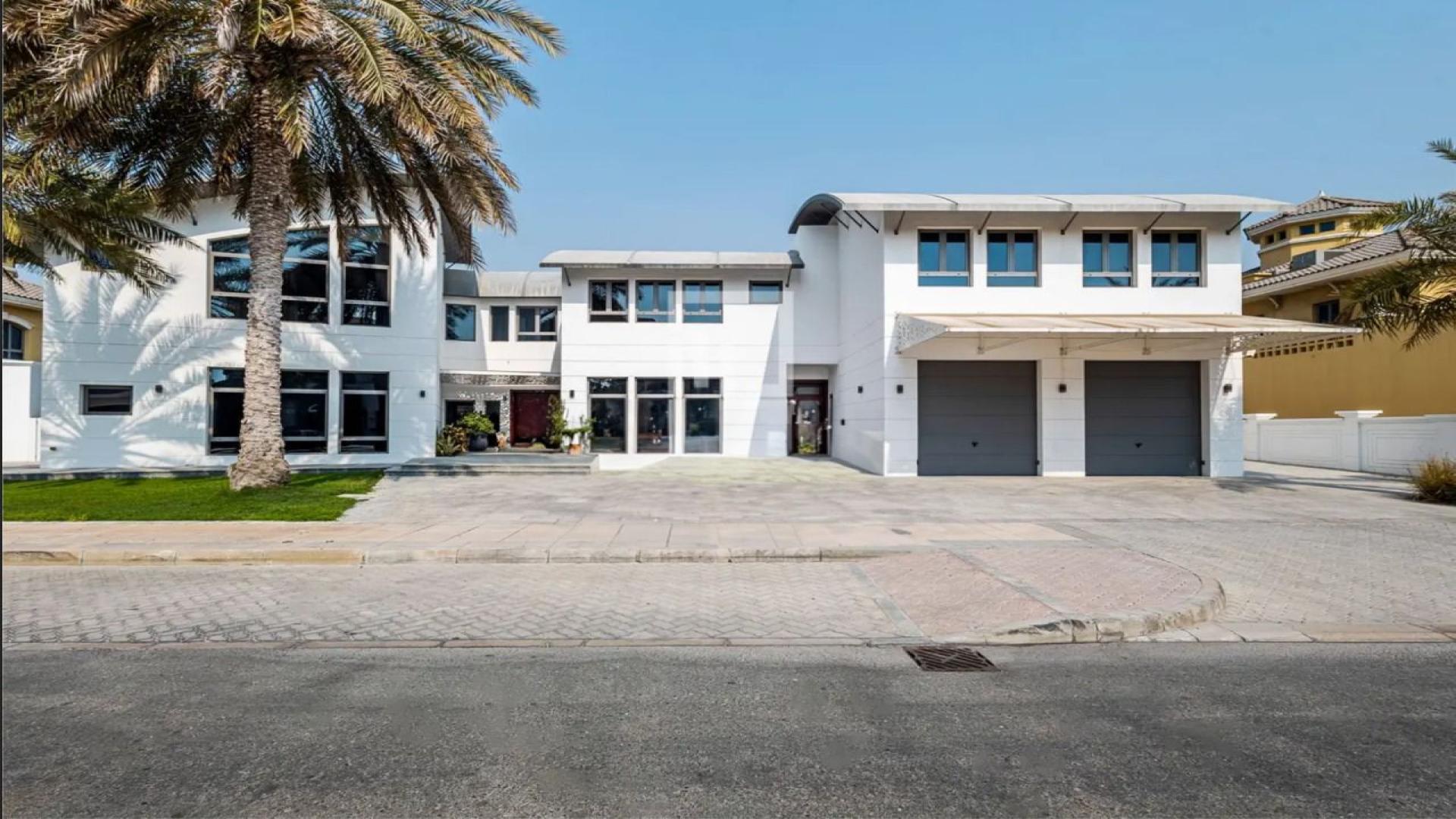 Luxurious Palm Jumeirah villa with private pool, spacious patio, and modern architecture for sale