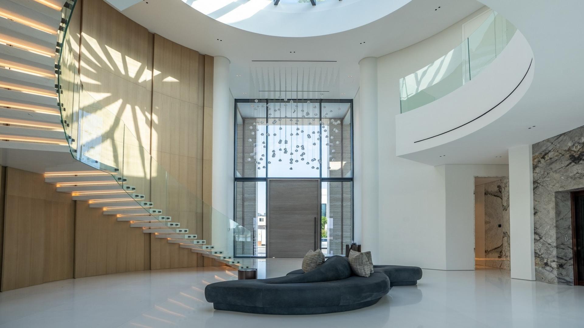 Luxurious Palm Jumeirah villa with pool and waterfront view at sunset, Signature Villas