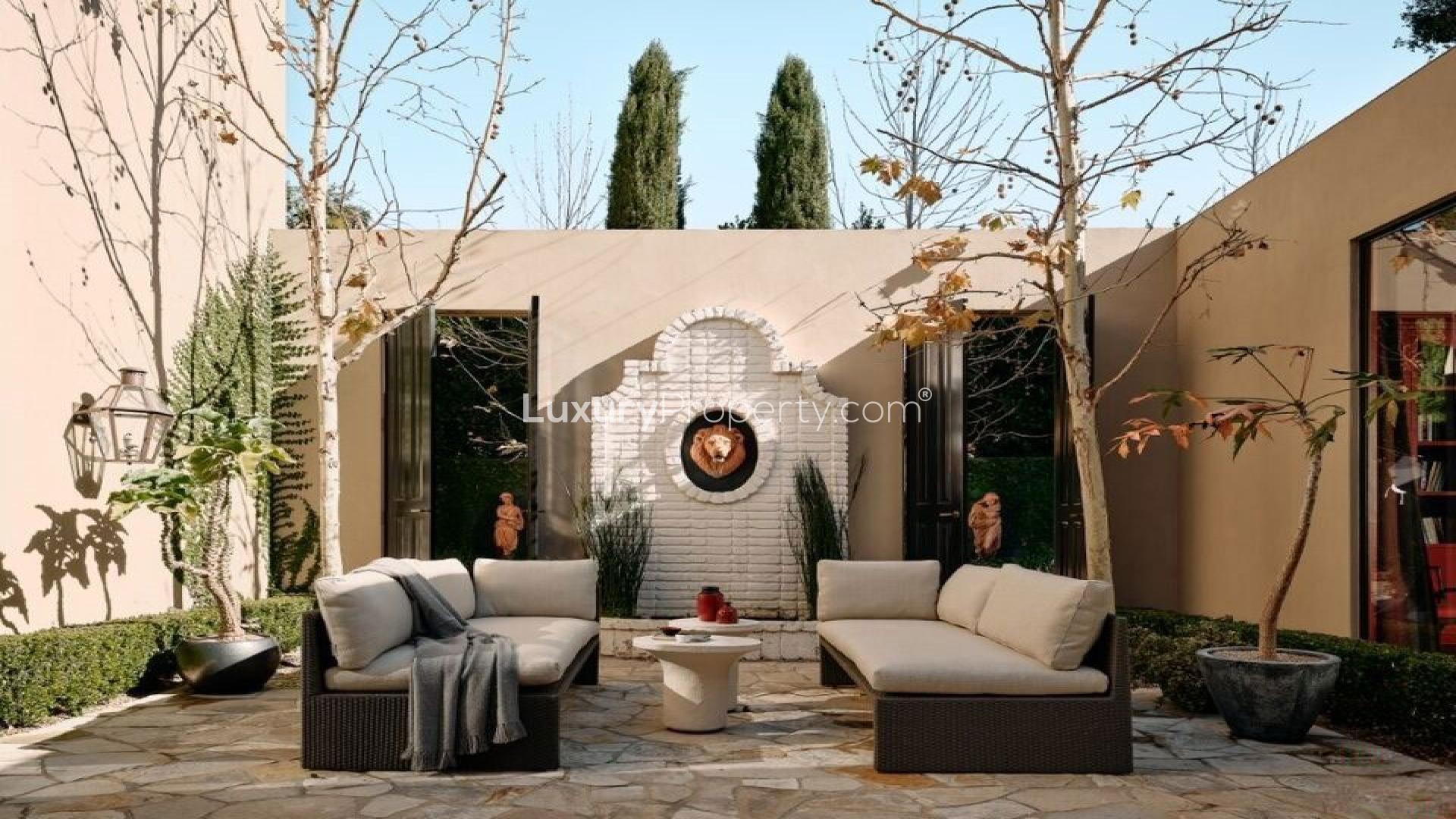 Luxurious Hollywood Regency villa interior with elegant staircase in Bel Air, Los Angeles