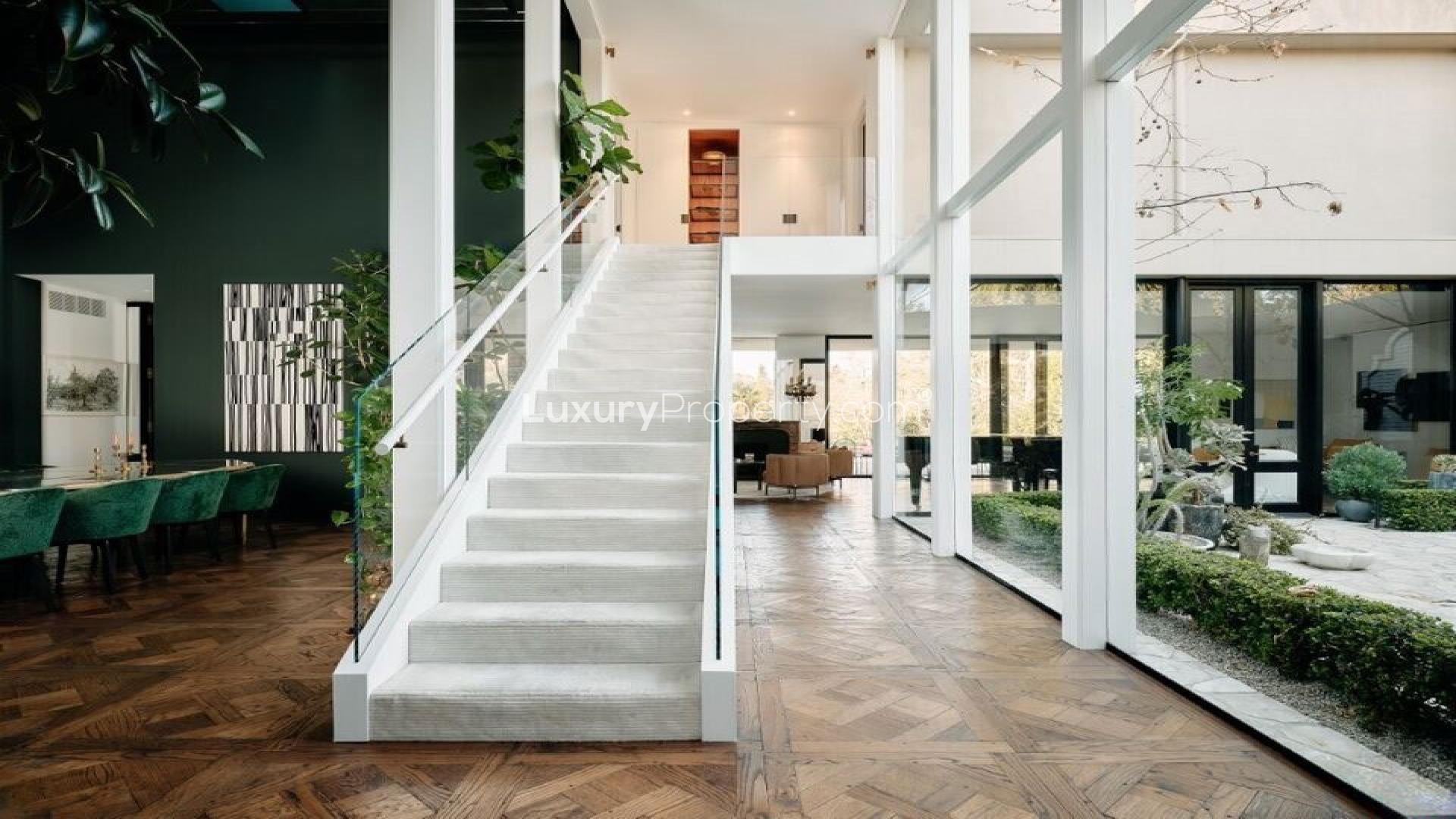 Elegant Bel Air villa exterior with pool and fire pit, Hollywood Regency style, for sale