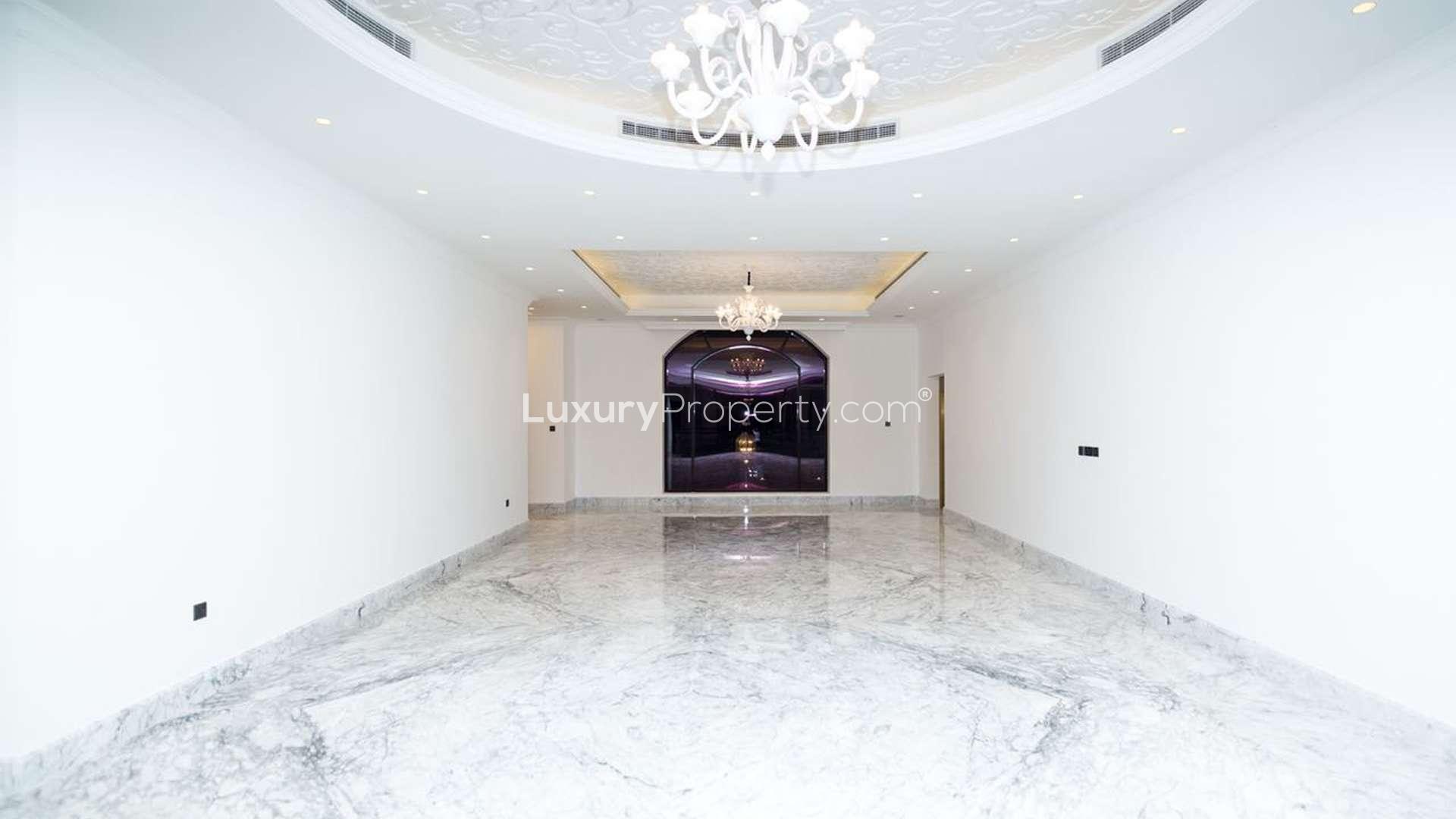 Luxurious marble-floored villa interior with grand staircase in Al Sufouh, Dubai