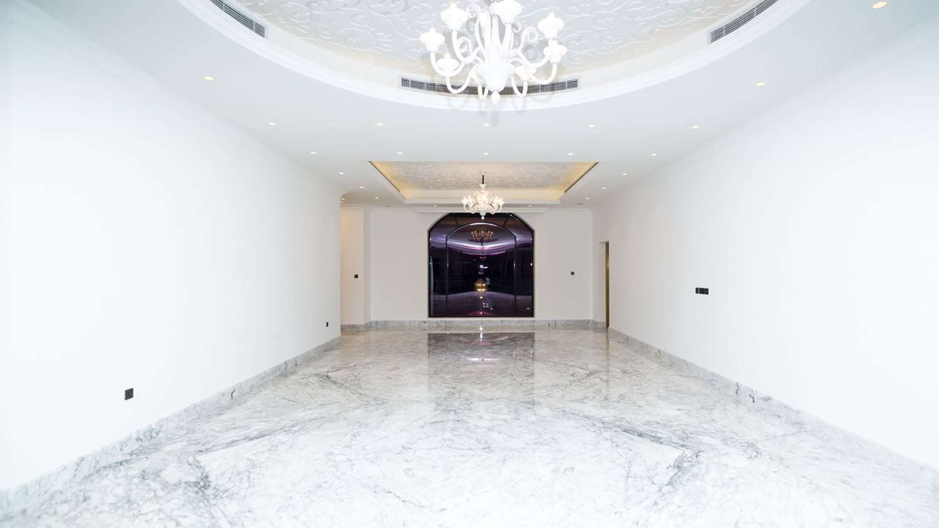 Luxurious marble-floored villa interior with grand staircase in Al Sufouh, Dubai