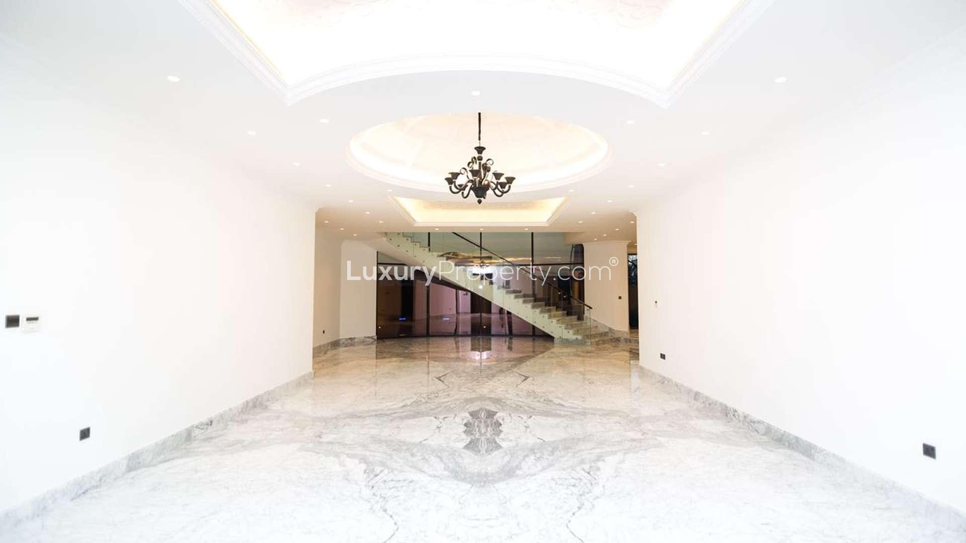Luxurious 6-bedroom villa exterior in Al Sufouh, Dubai, with elegant nighttime lighting