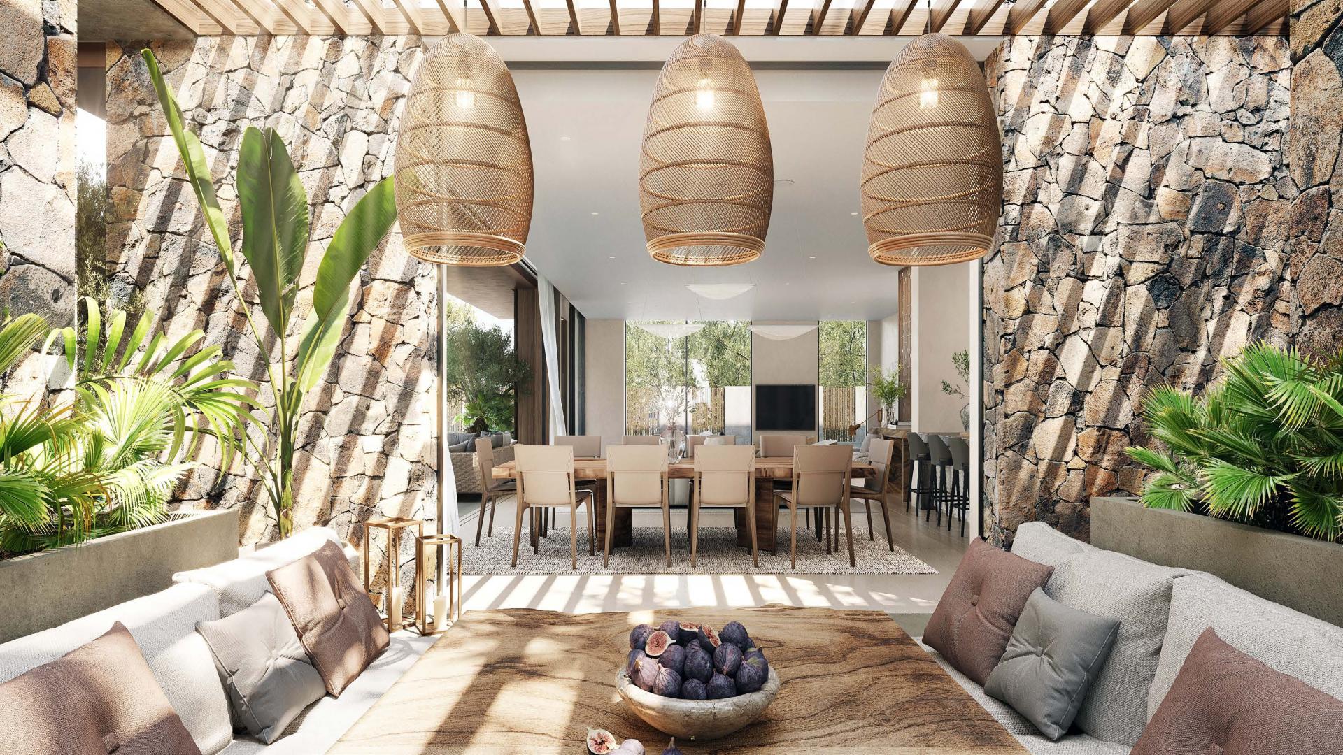 "Modern villa office overlooking pool in Tilal Al Ghaf, Alaya community, for sale.",Contemporary villa terrace with stone walls and stylish seating in Tilal Al Ghaf, Alaya