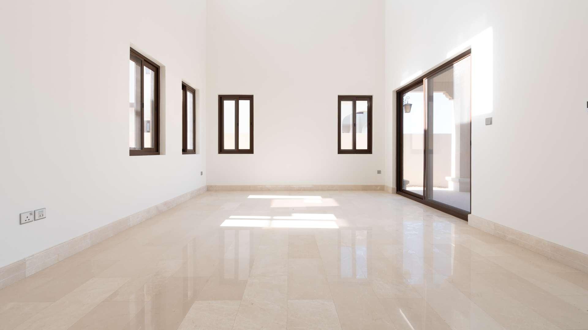 Empty room with large windows in Aseel Type 4 Villa, Arabian Ranches
