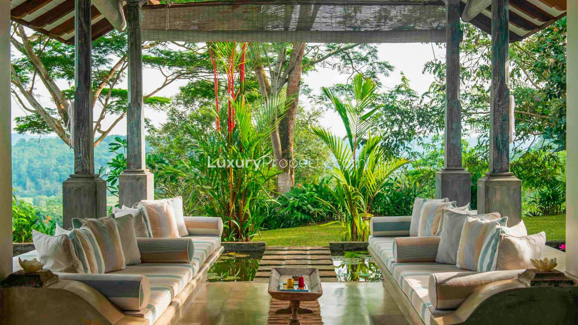 Spacious living area in 6-bedroom villa, Pokkuluwa, Galle, featuring elegant decor and greenery