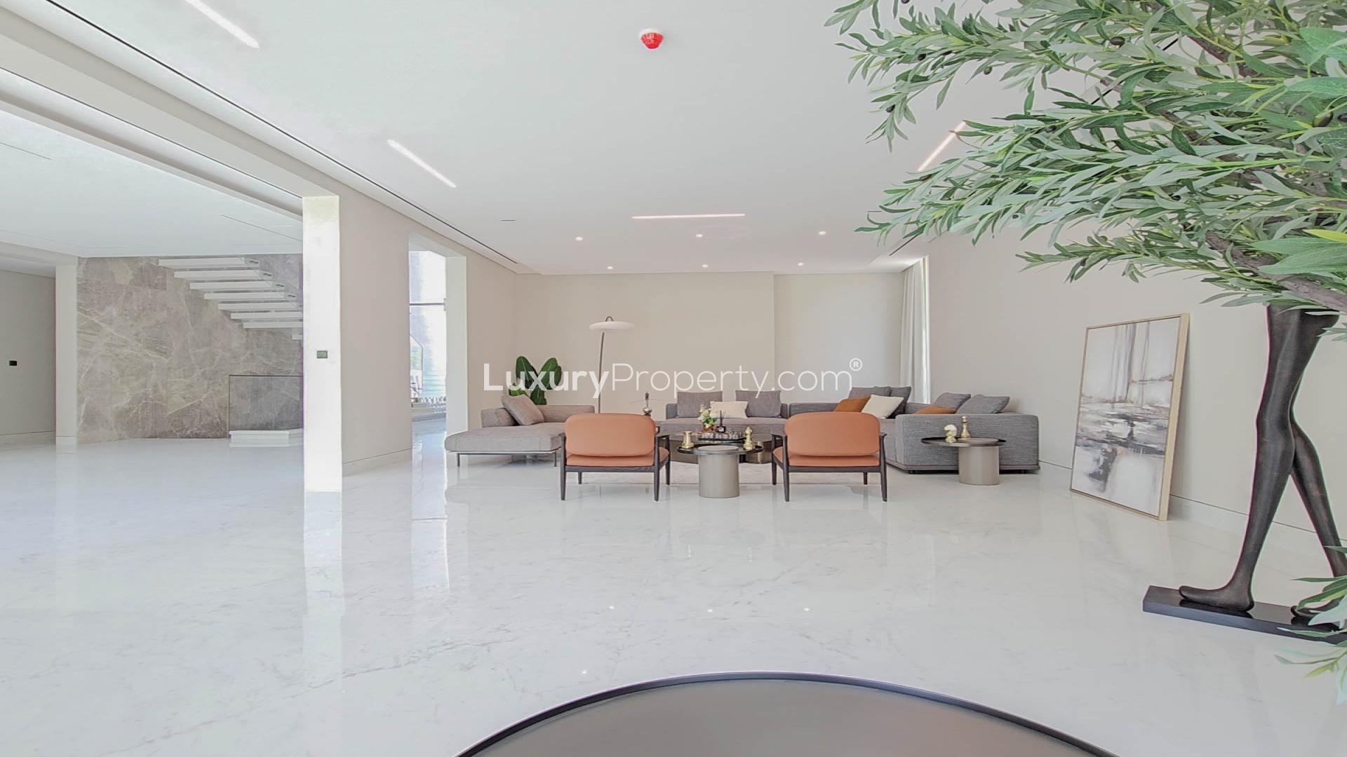 N/A,Modern living room in 6-bedroom villa, Pearl Jumeirah, with elegant furniture and marble floors