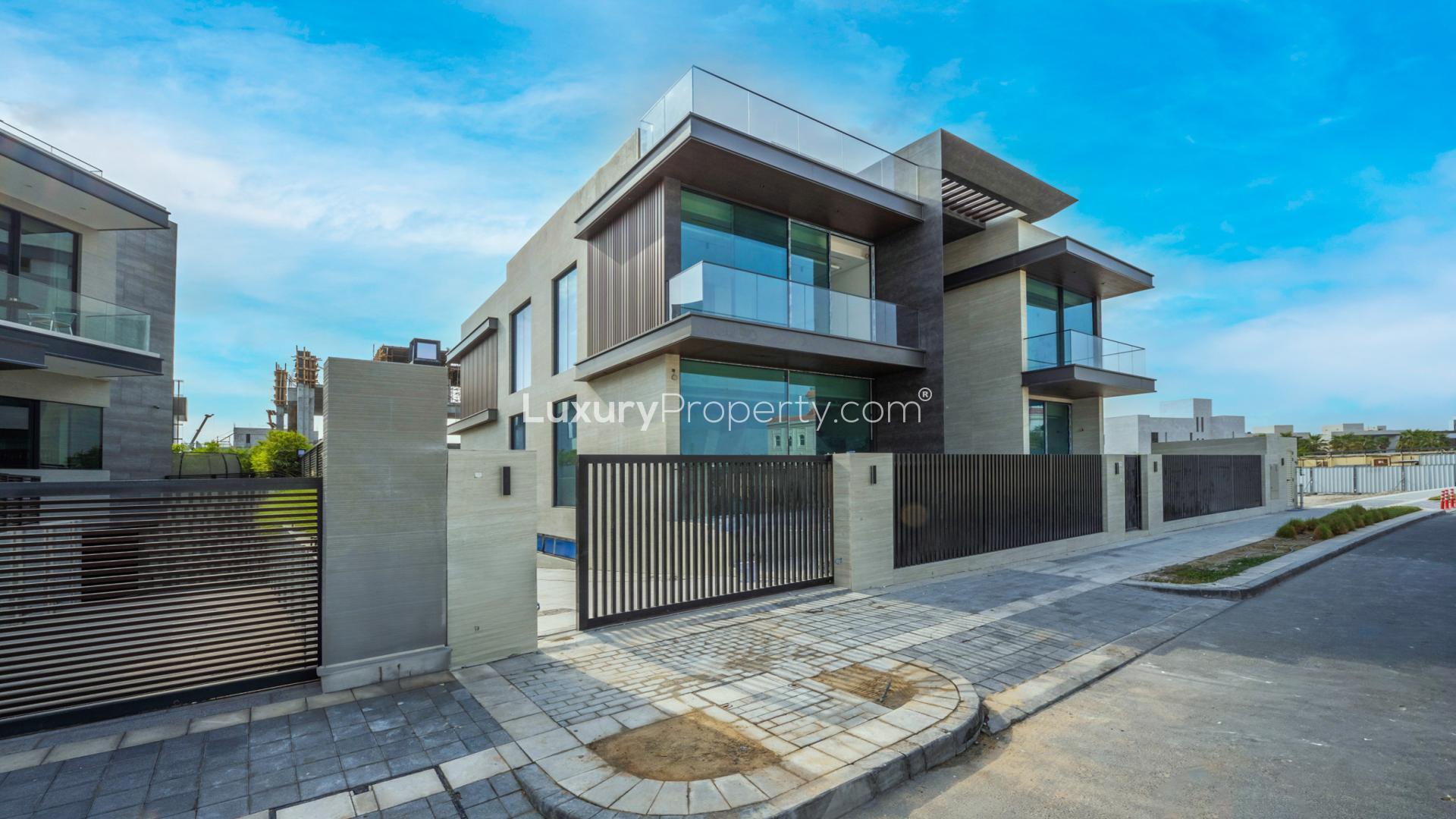 Stunning modern villa exterior in Pearl Jumeirah, Jumeirah community, with landscaped garden path