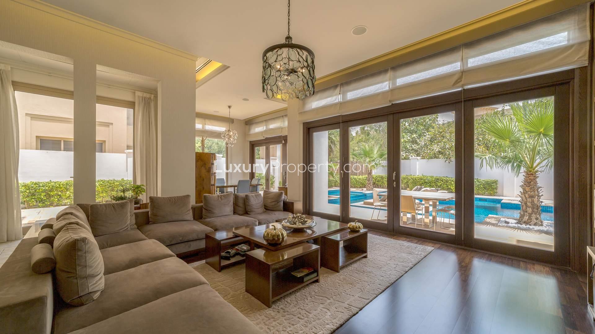 Luxurious living room in six-bedroom villa, Al Barari, featuring modern decor and elegant furnishings