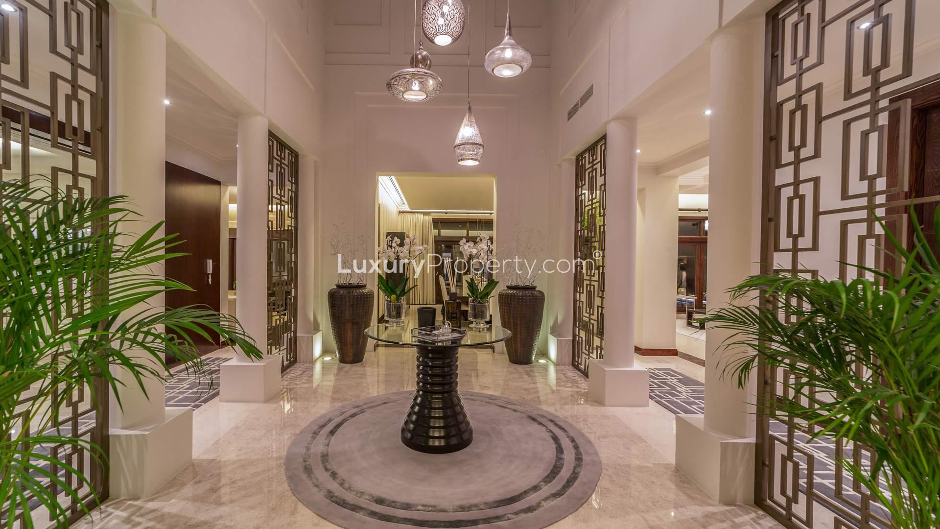 Luxurious entrance of 6-bedroom villa in Al Barari's Desert Leaf, Dubai at night
