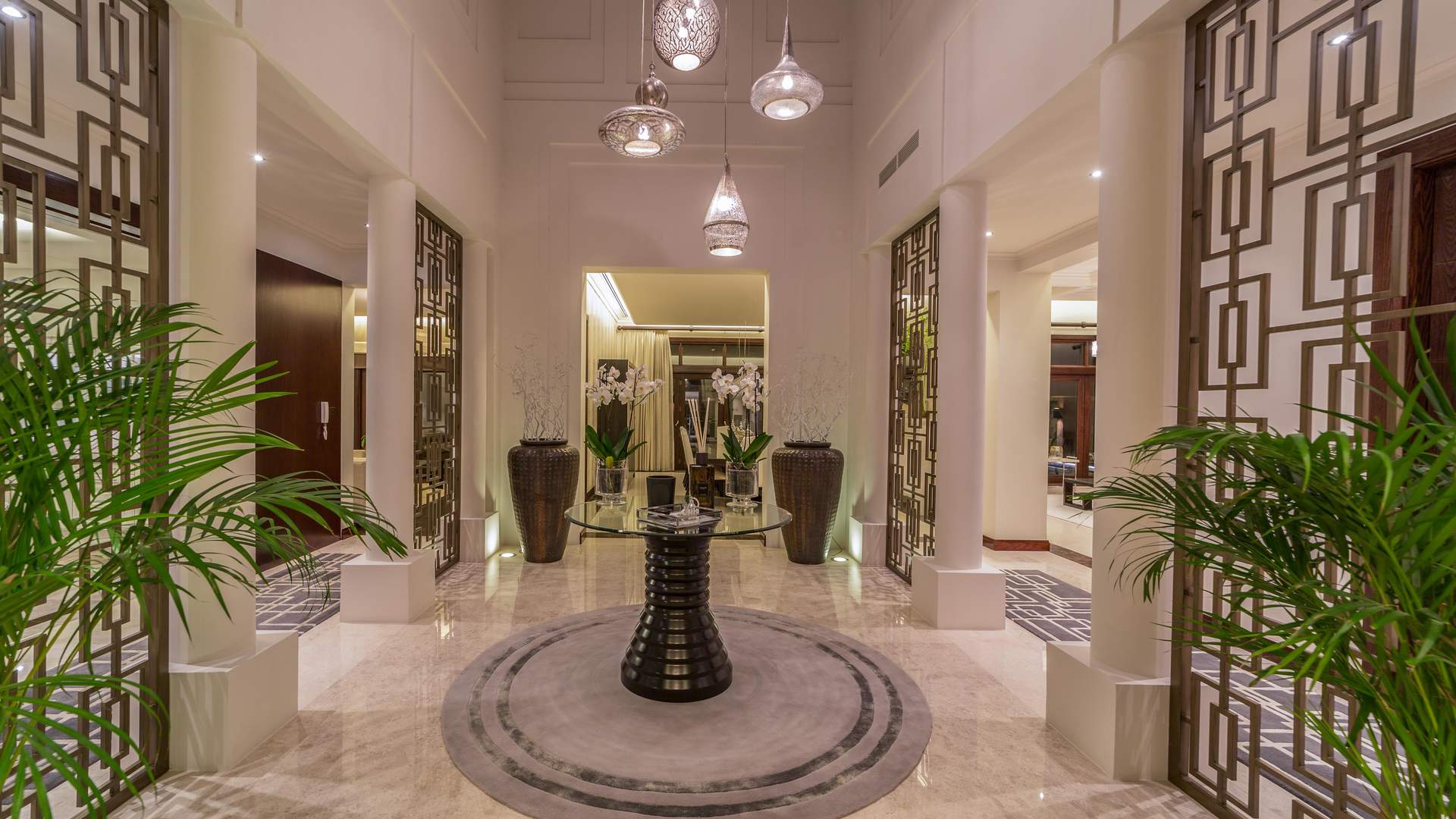 Luxurious entrance of 6-bedroom villa in Al Barari's Desert Leaf, Dubai at night