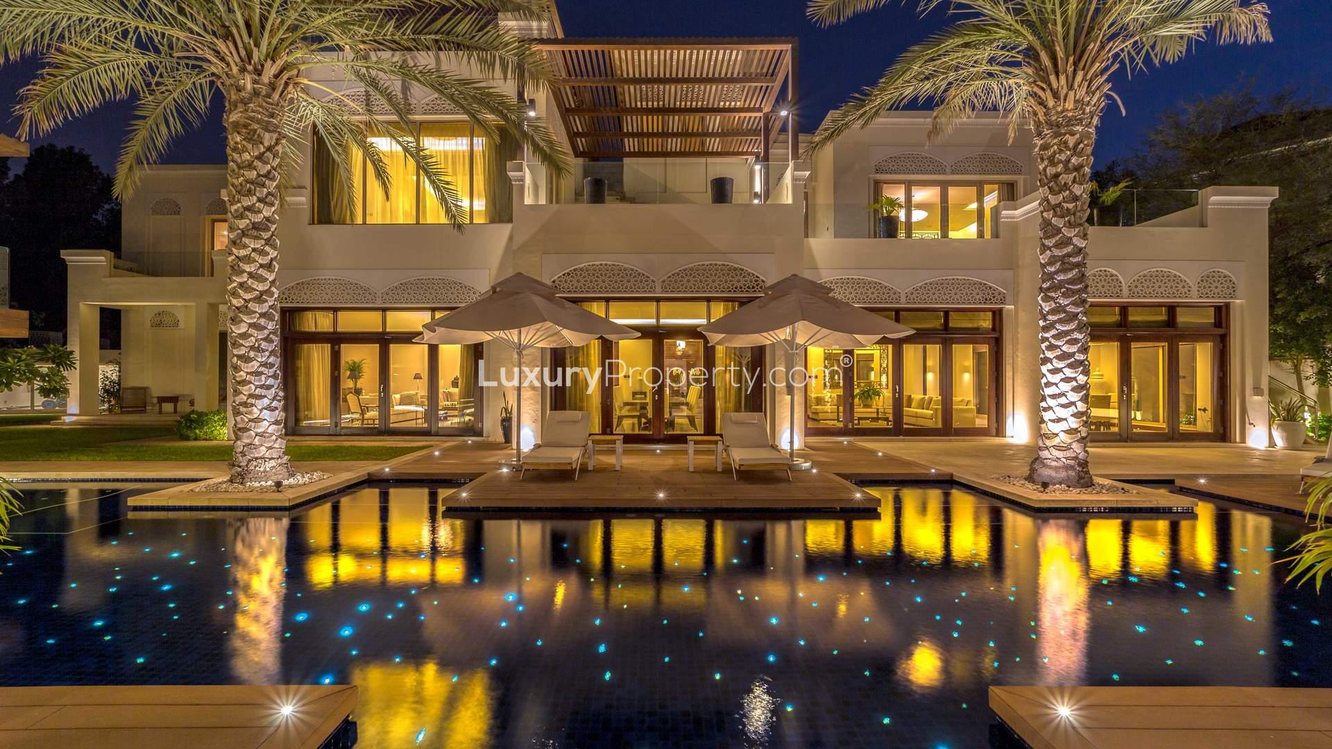 Luxurious entrance of 6-bedroom villa in Al Barari, Dubai with elegant decor and lighting