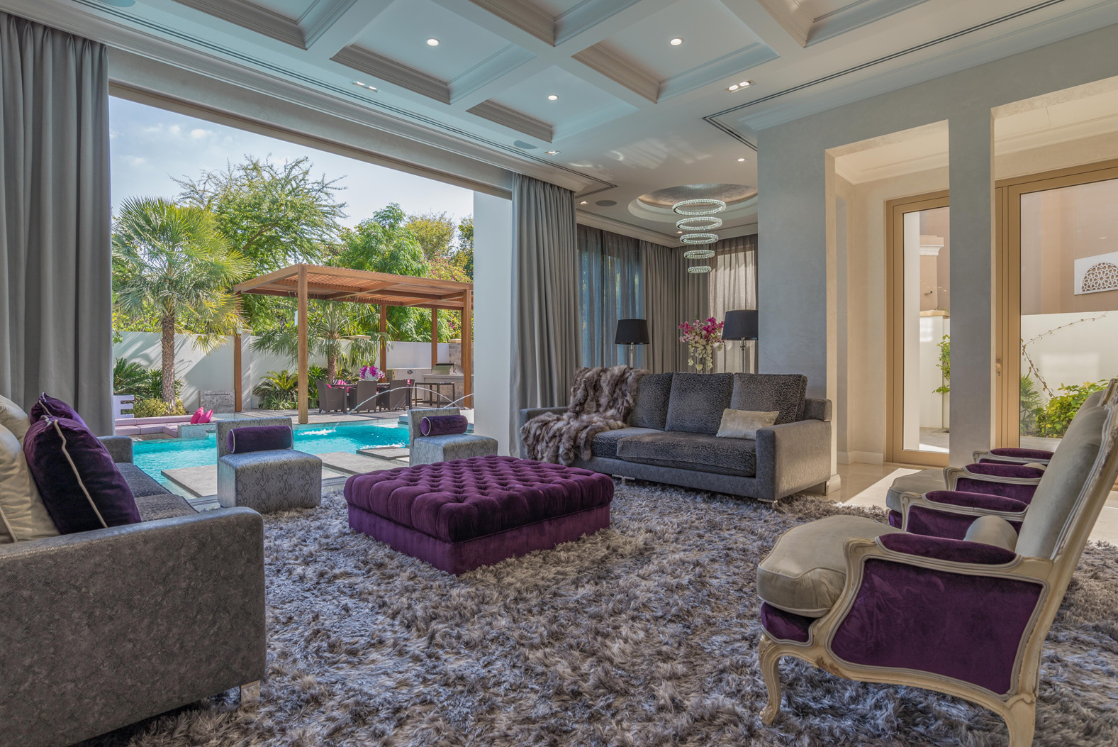 Luxury Bromellia Villa living room with pool view in Al Barari, Dubai