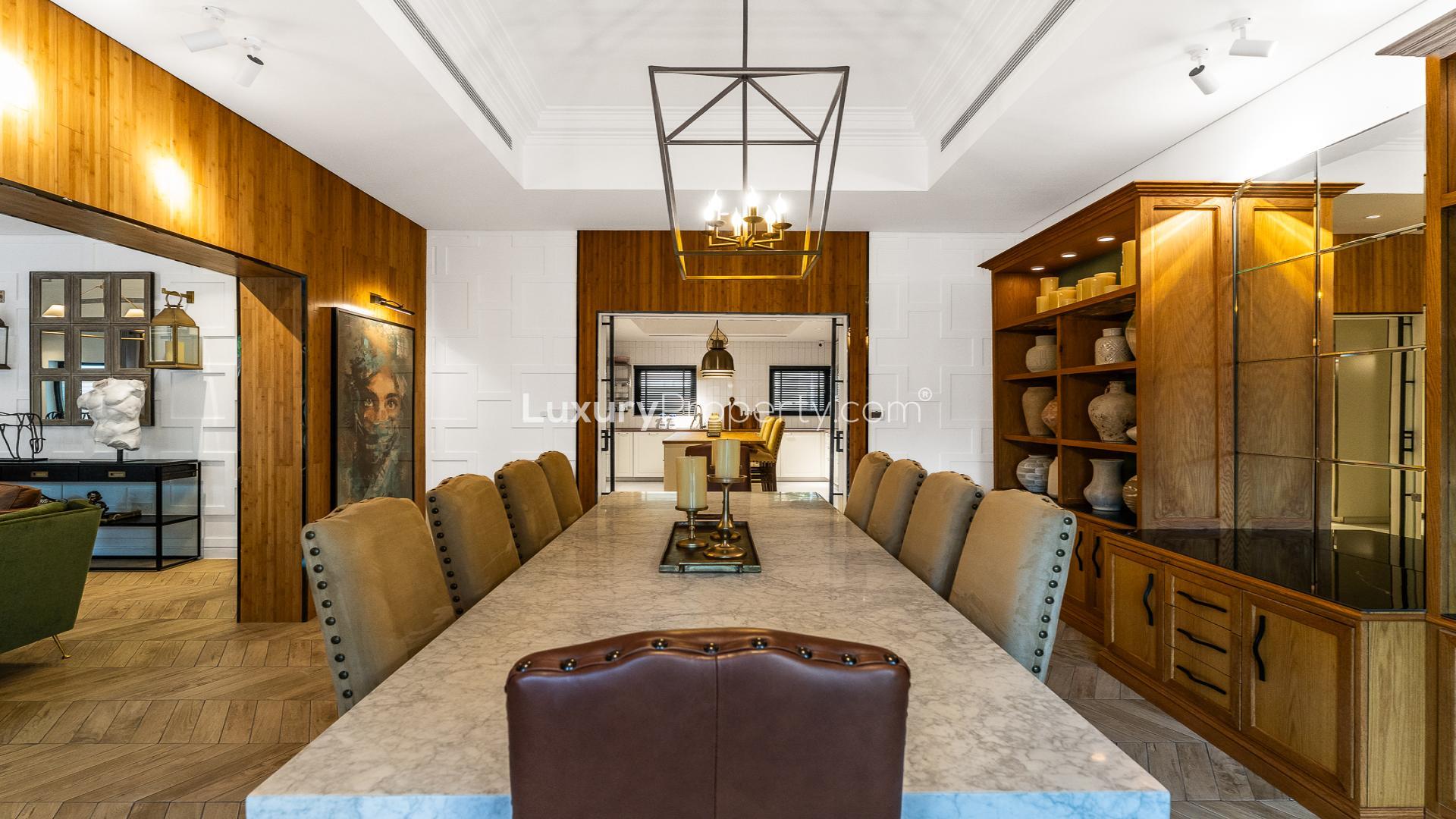 Luxurious dining room in six-bedroom villa, Al Furjan North Village, marble table, elegant decor
